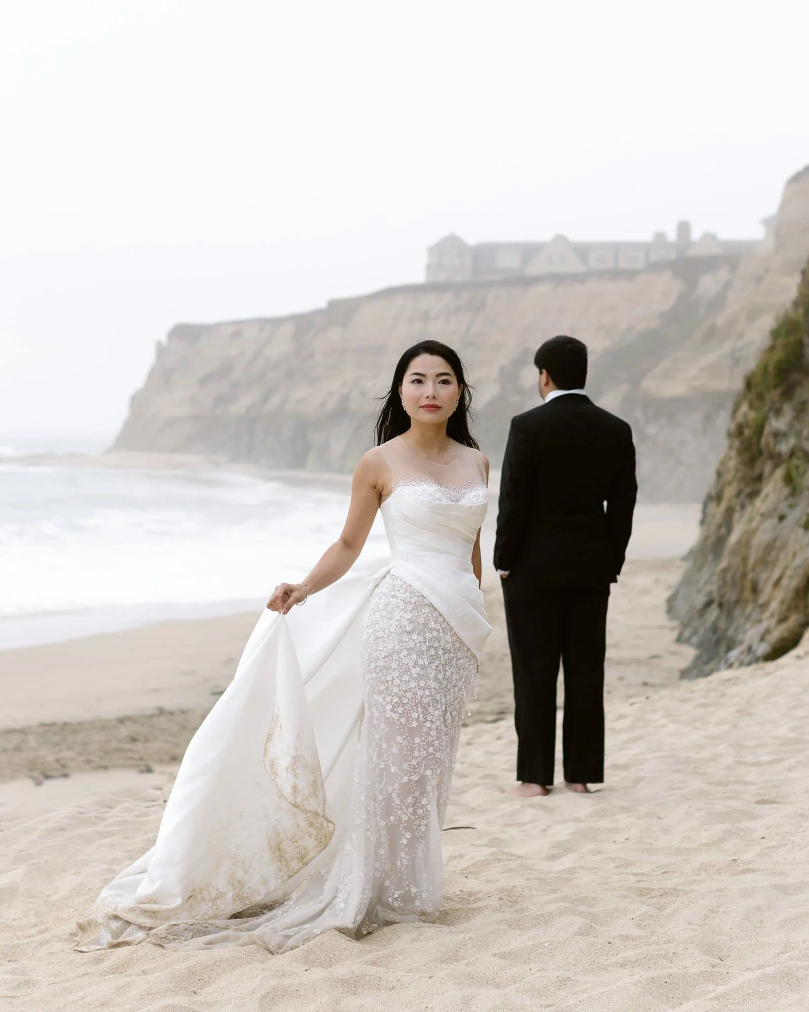 editorial wedding photographer bride in lace gown on beach Half Moon Bay California coastal cliffs