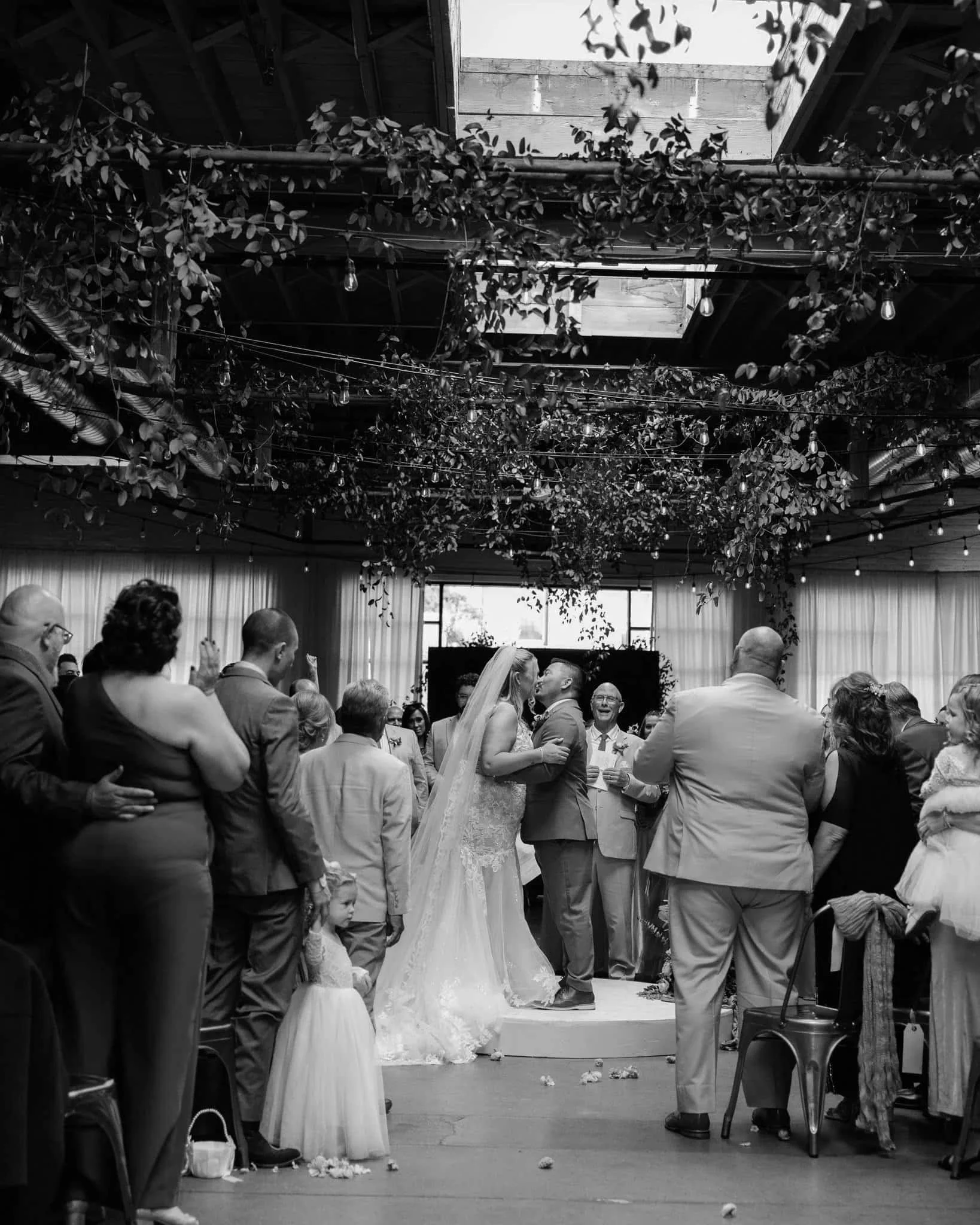 First kiss at Denver wedding venue — cinematic Colorado wedding photographer