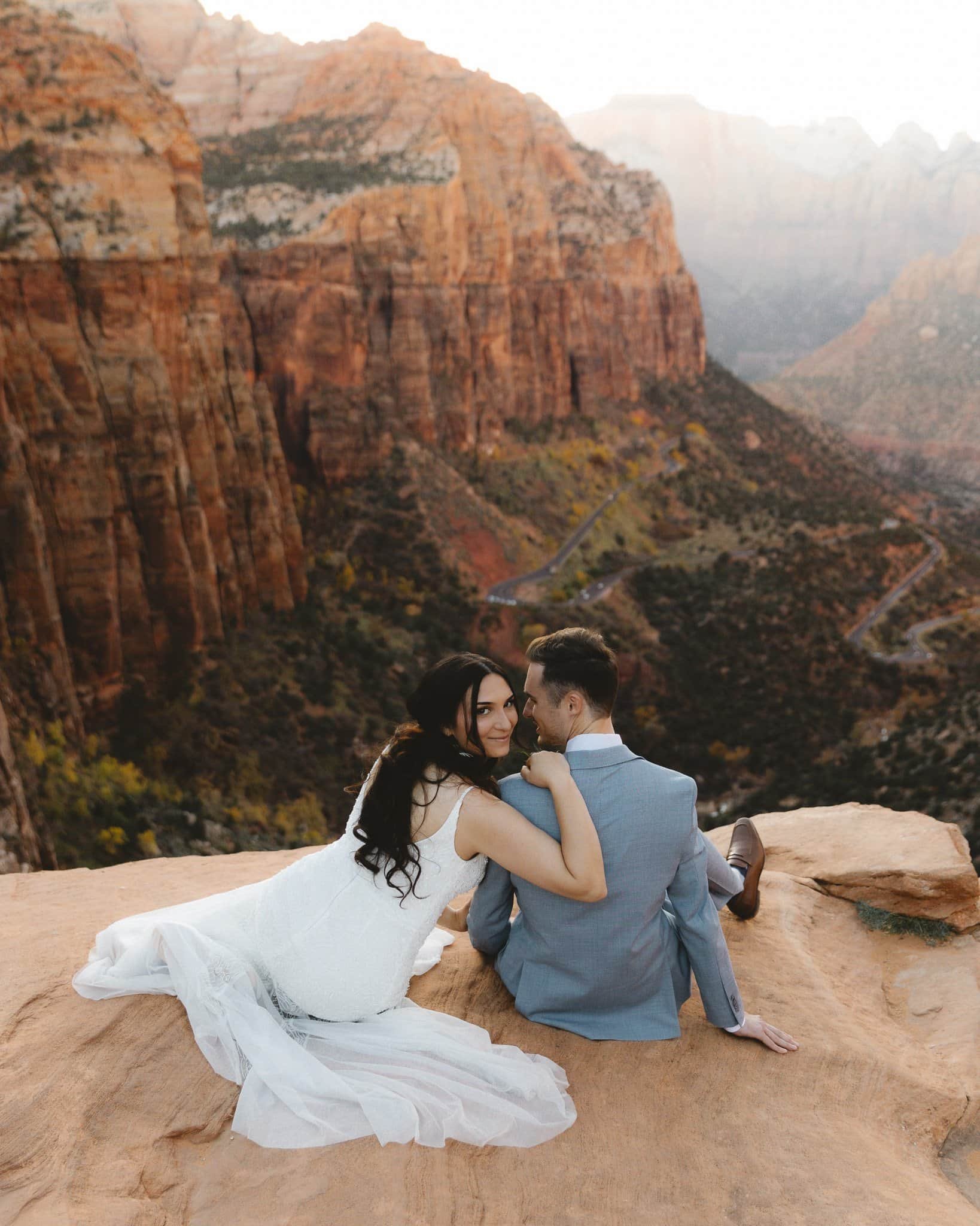 Couple eloping at Zion National Park canyon overlook at sunset — Utah wedding photographer Jenna Roden