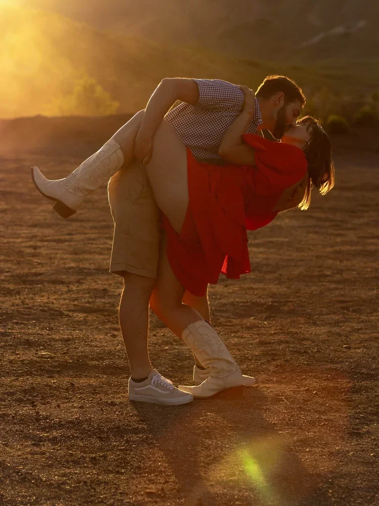 Couple at golden hour kiss — cinematic Texas wedding photography at the stockyards. Forth Worth, Texas.