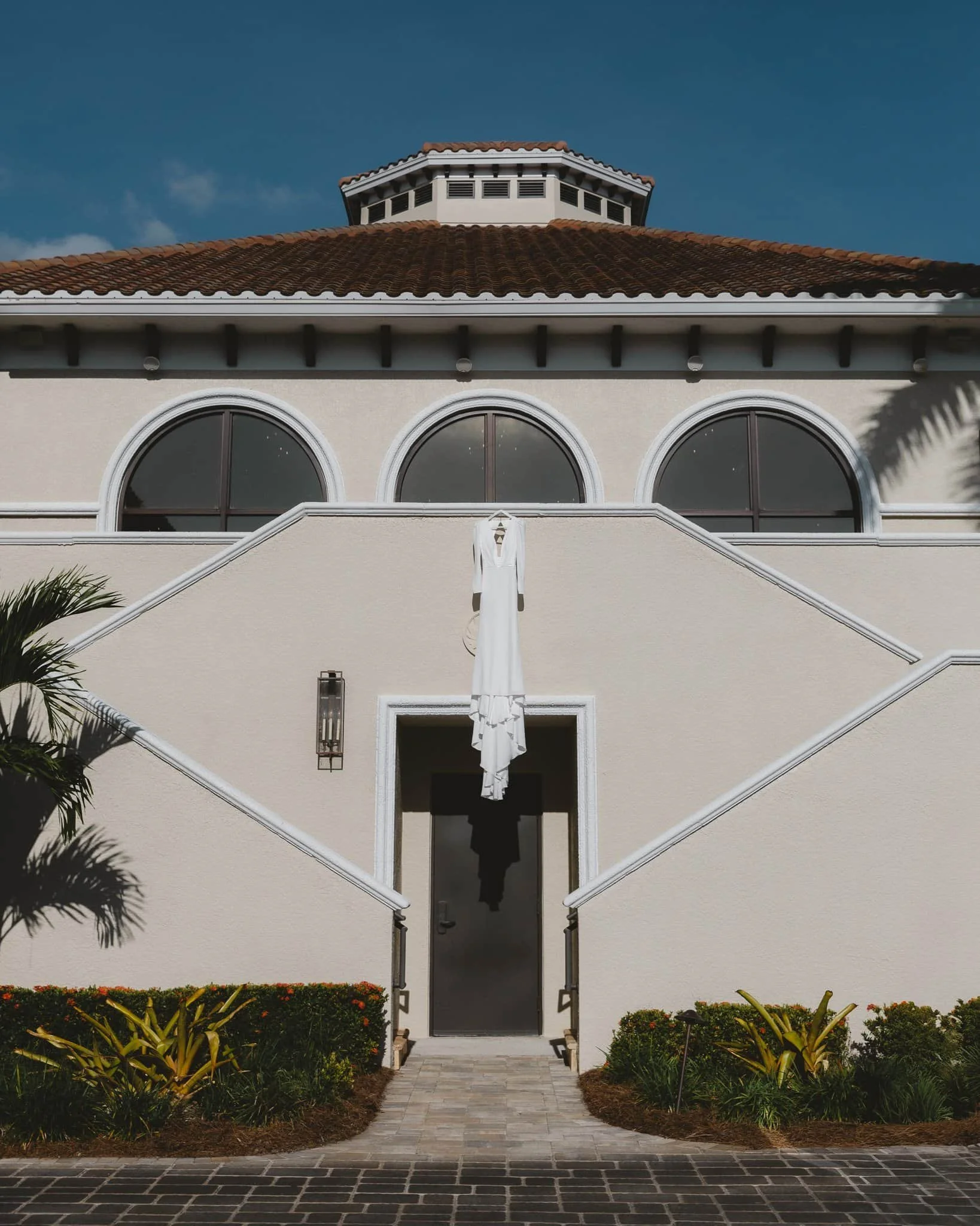 Wedding dress hanging at Heritage Bay Golf Club — Gulf Coast wedding photographer