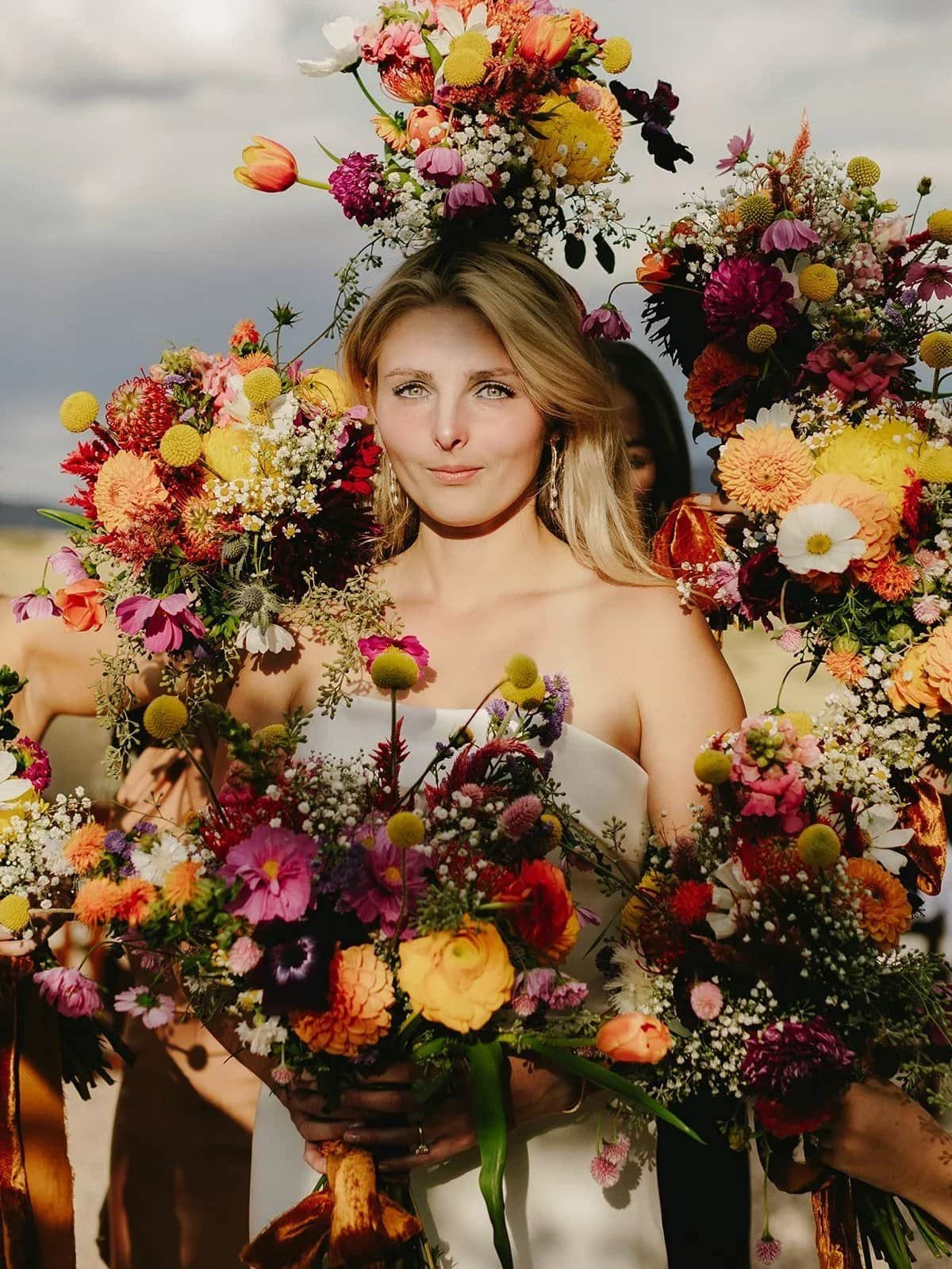 Bride framed by a wildflower wreath at High West Distillery in Park City — Utah wedding photographer Jenna Roden
