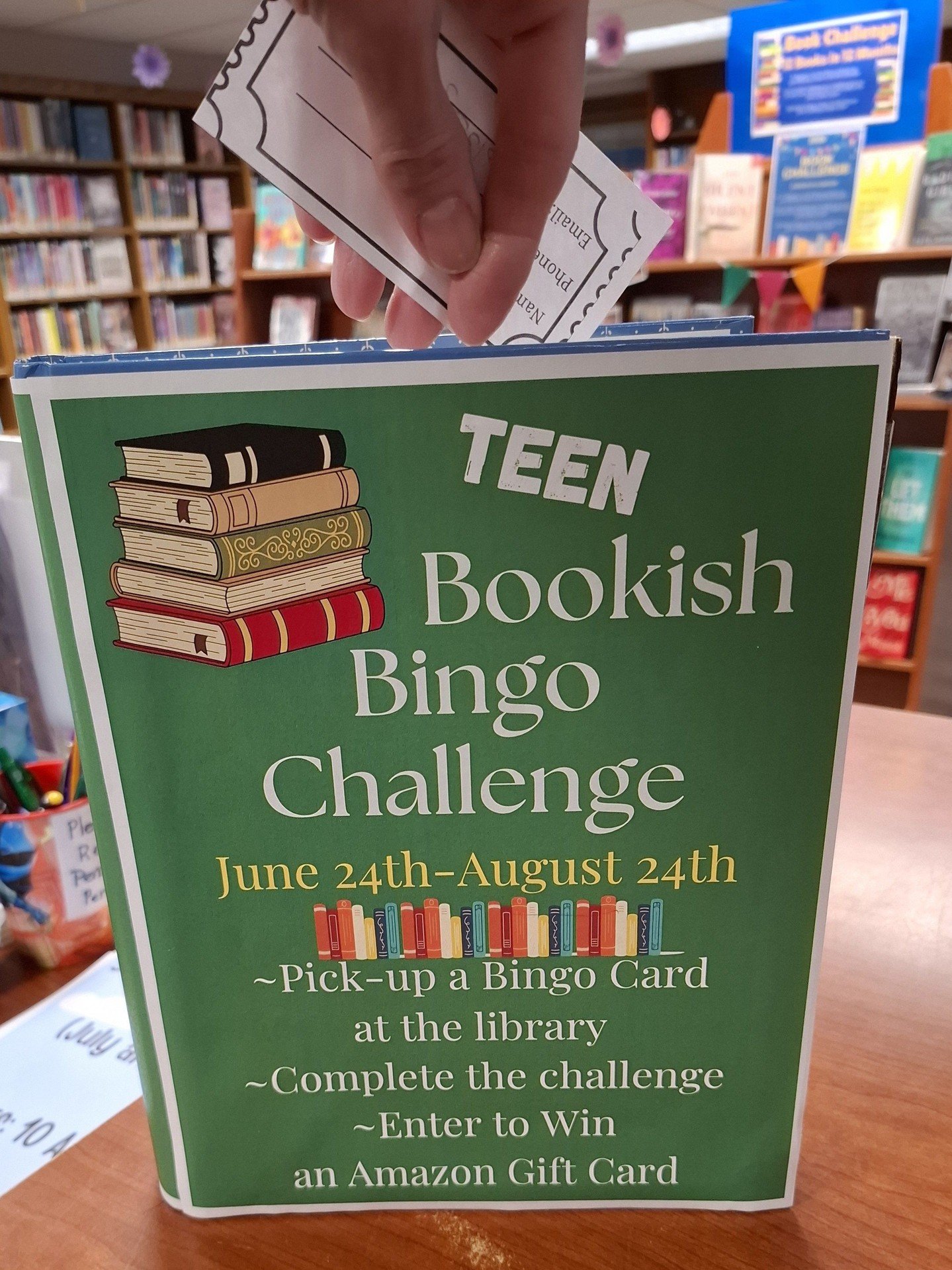 One month left for the Teen Bookish Bingo Challenge!! ⁠
⁠
There's still time to pick up a bingo card at the library! Complete the challenge for the chance to win an Amazon Gift Card 🎁