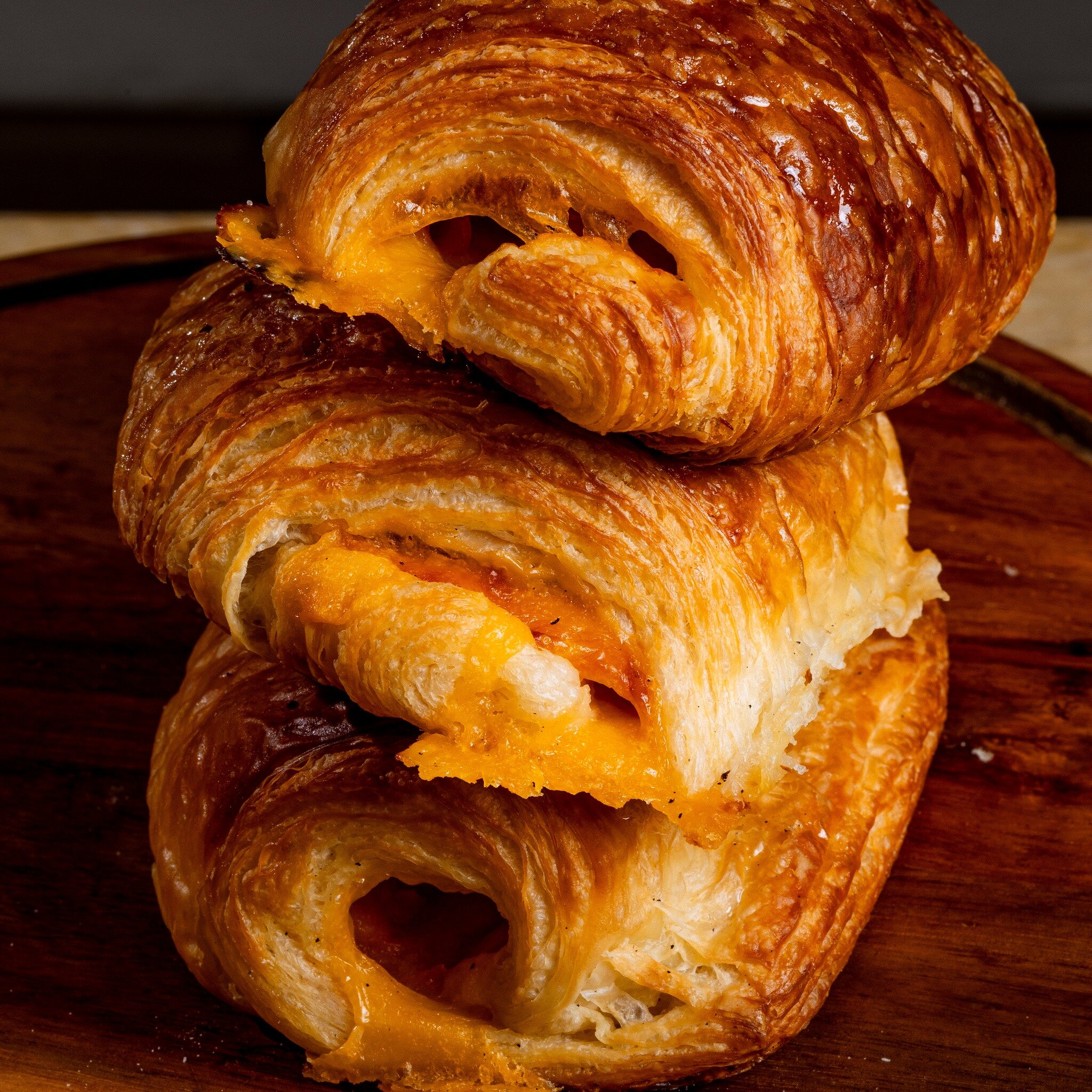 Whether they&rsquo;re filled with ham &amp; cheese, sprinkled with almonds, or just your classic, flaky goodness...we are NOT joking around when it comes to our croissants. 

#wearetrueblue #hampsteadnc #wilmingtonnc #bakery #ncbakery