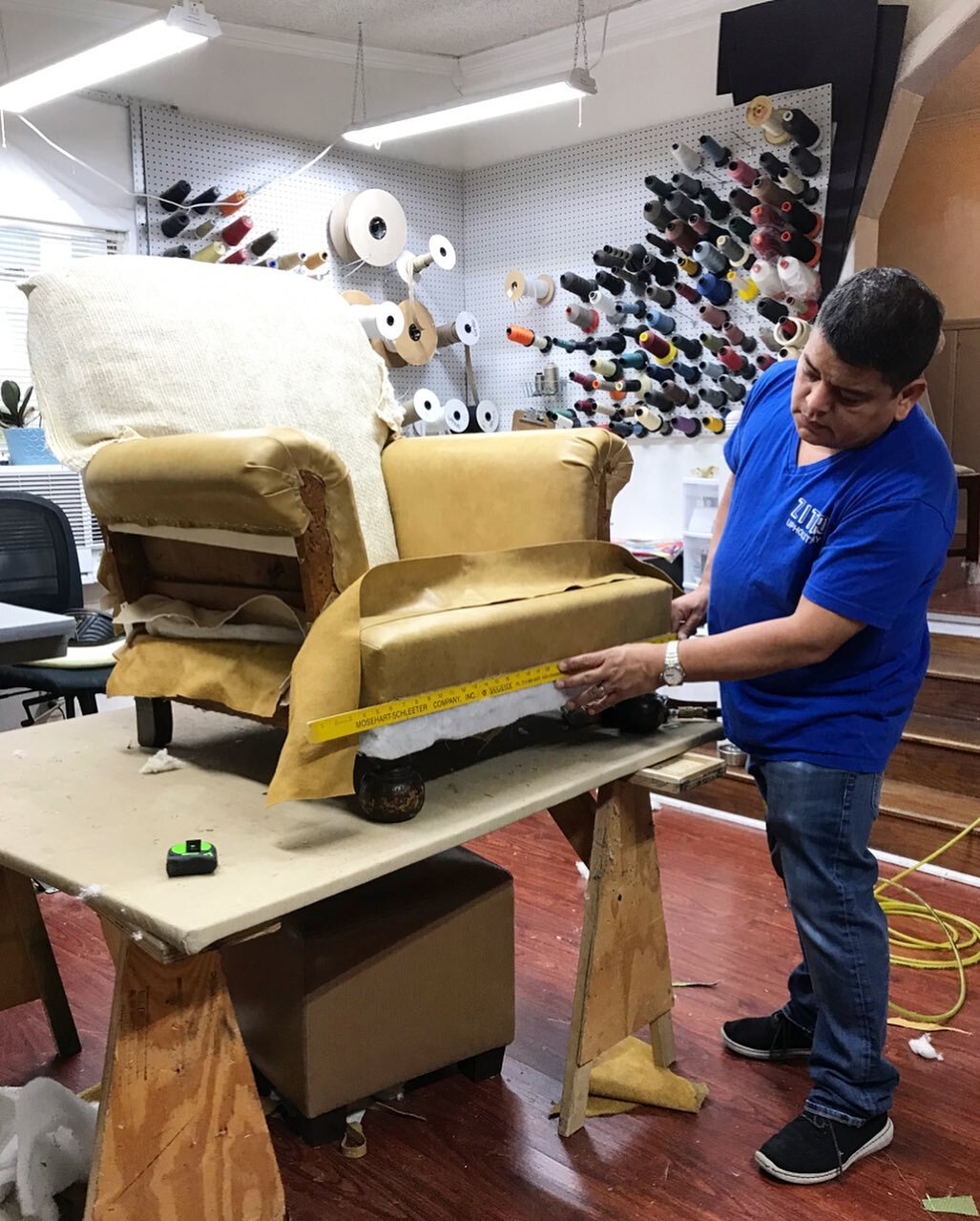 On to the next project! Josue, owner and lead upholsterer is working on a club chair with a matching ottoman and recovering it in a beautiful leather hide. Stay tune for after pictures!