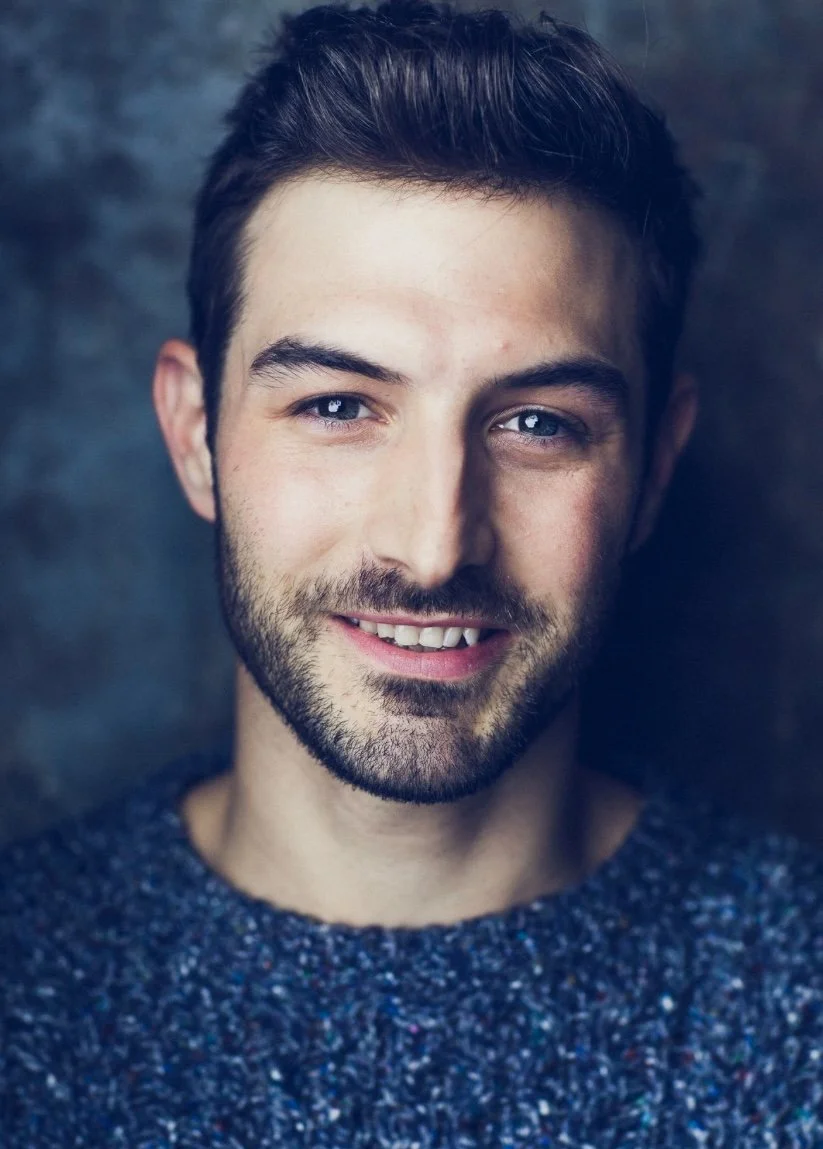 justin genna sweater headshot proper format.jpg