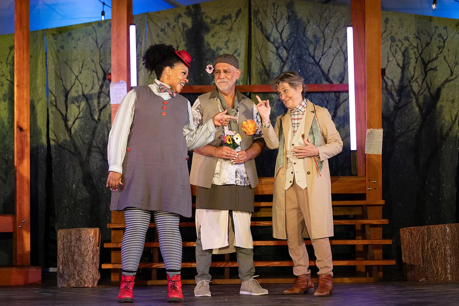 three humorous actors standing on stage