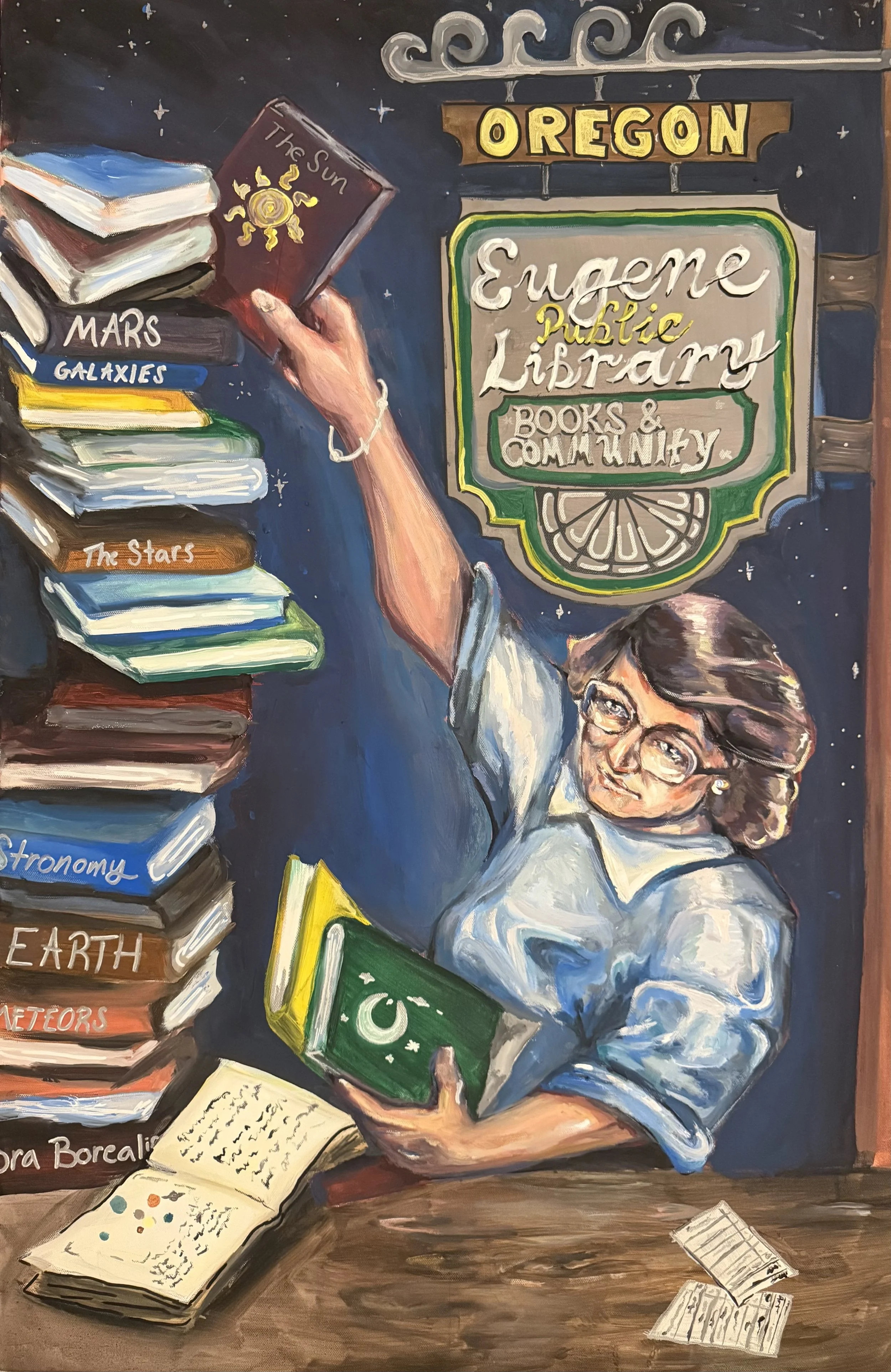 5. Title: Books Are Guiding Stars, Description: I have always loved to read and Eugene is definitely one of the most welcoming communities I’ve had the pleasure of living in. I wanted to do a piece that spoke to those feelings. I also wanted it to sh