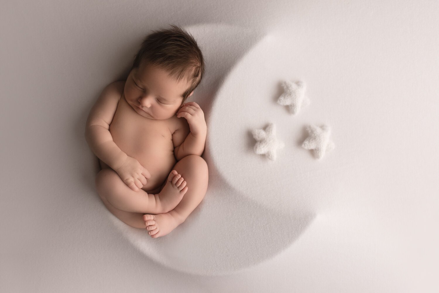 Baby boy in moon newborn photos