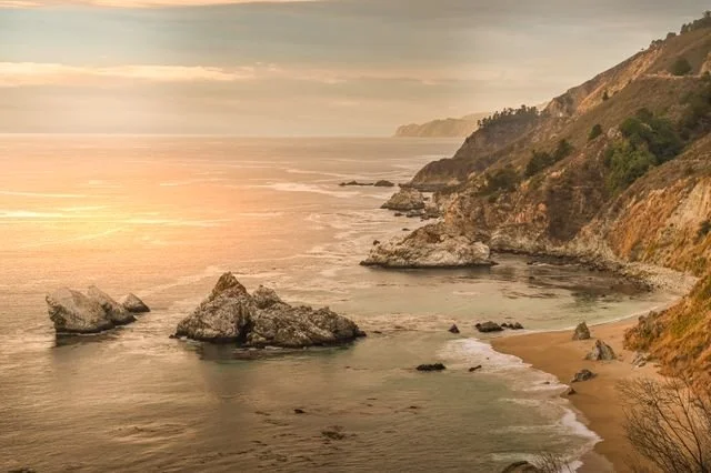 An image of the California coast at sunset