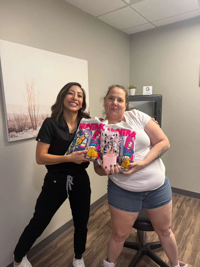 Dr. Stocks, podiatrist, receiving a K-pop Demon Hunter-themed bags of goodies from a patients’ mom