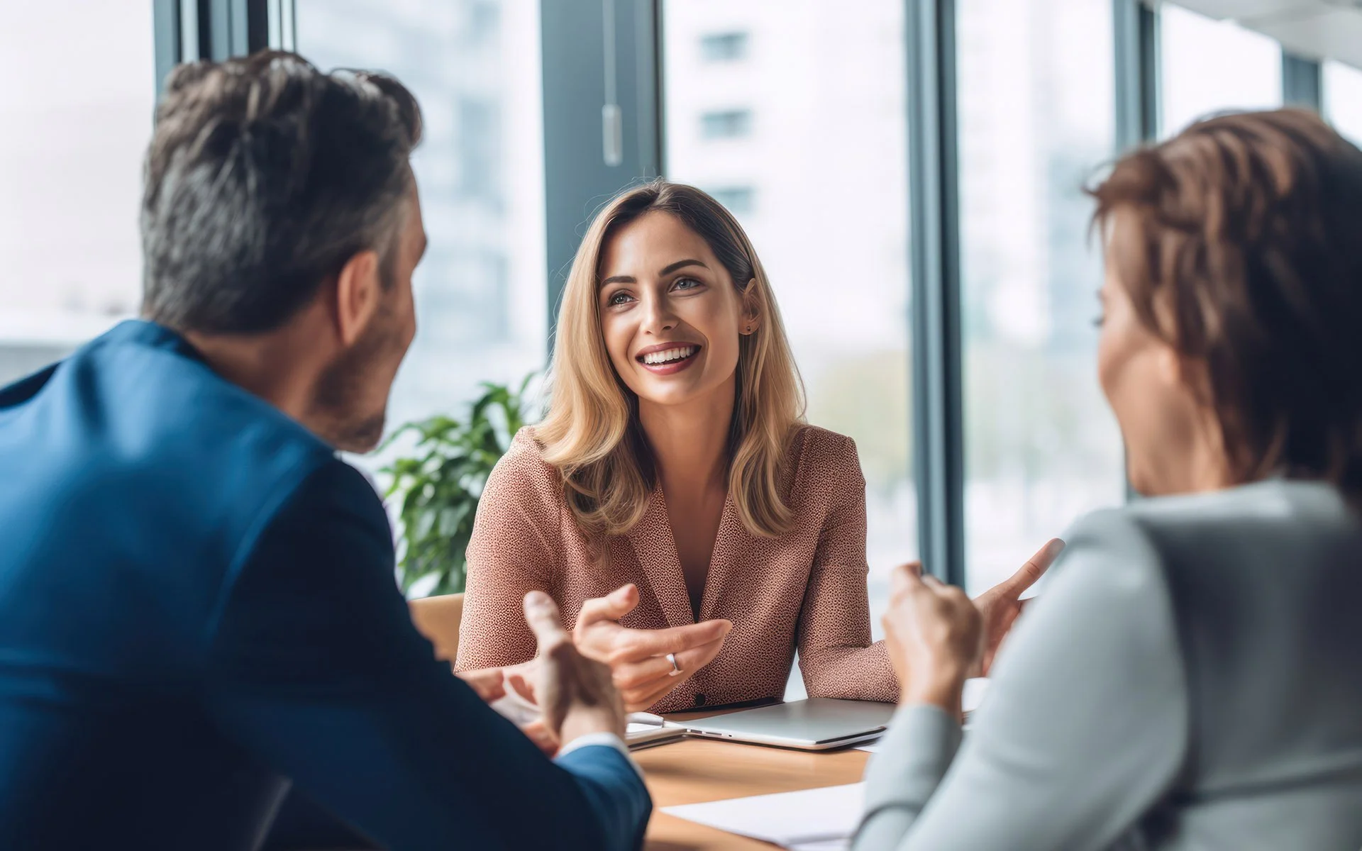 Financial professional shares her expertise with client couple in office