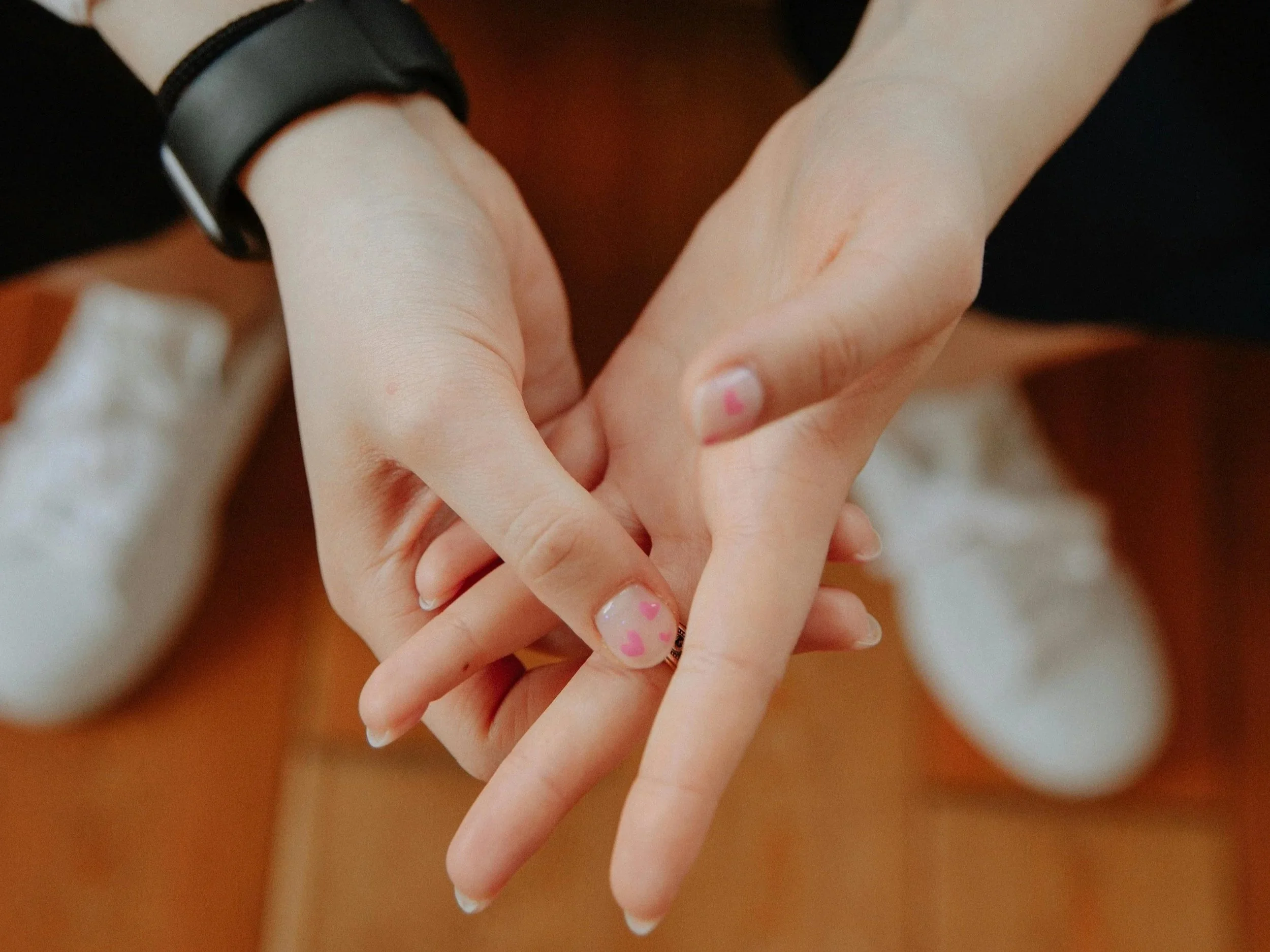 Close-up of hands resting calmly, symbolizing small somatic micropractices for nervous system regulation.