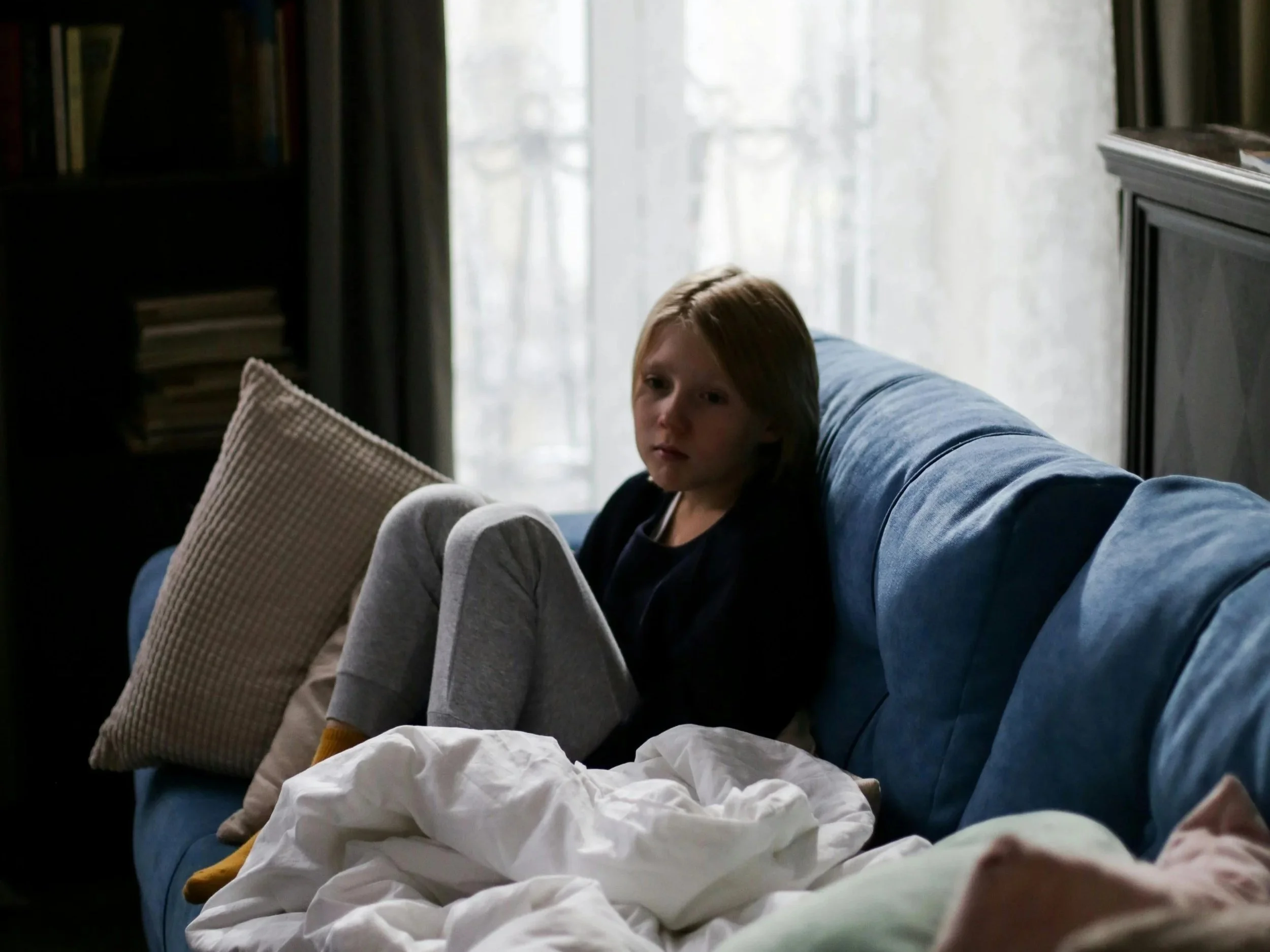 Overwhelmed child experiencing emotional stress at home.