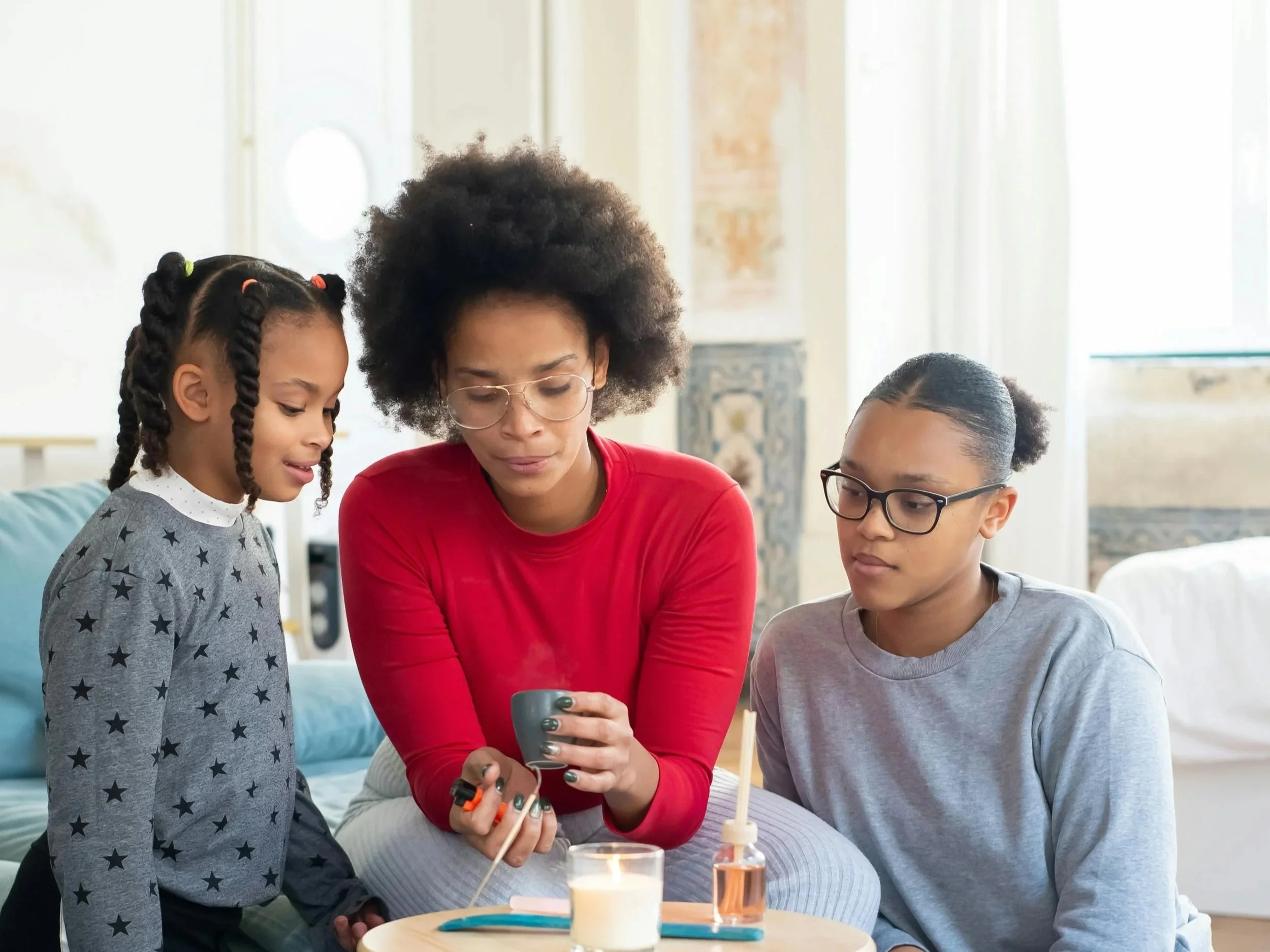 Family sitting together in a calm space during a time of transition, representing family counselling support.