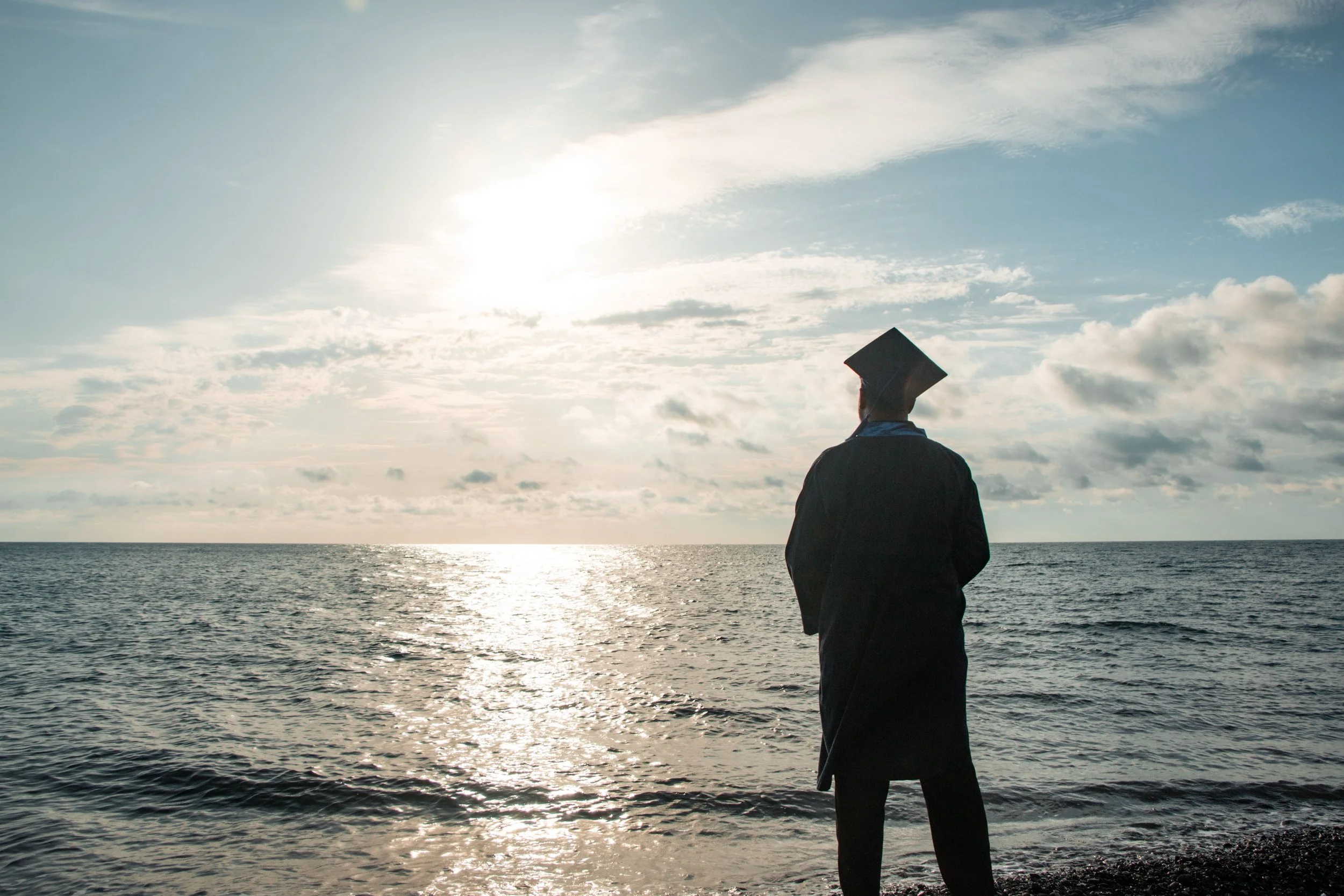 Person reflecting quietly after completing an important long-term goal