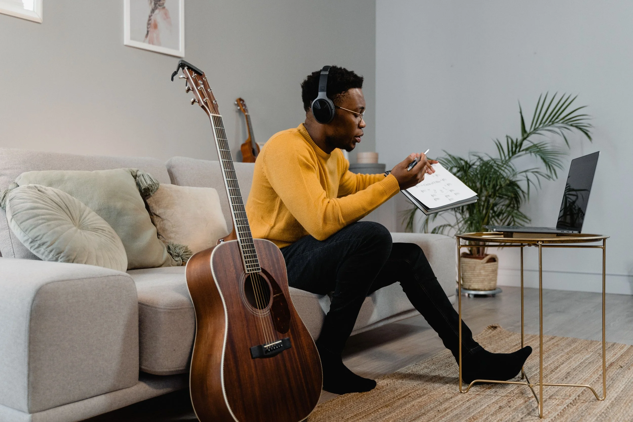 Adult using gentle background audio while working comfortably at home
