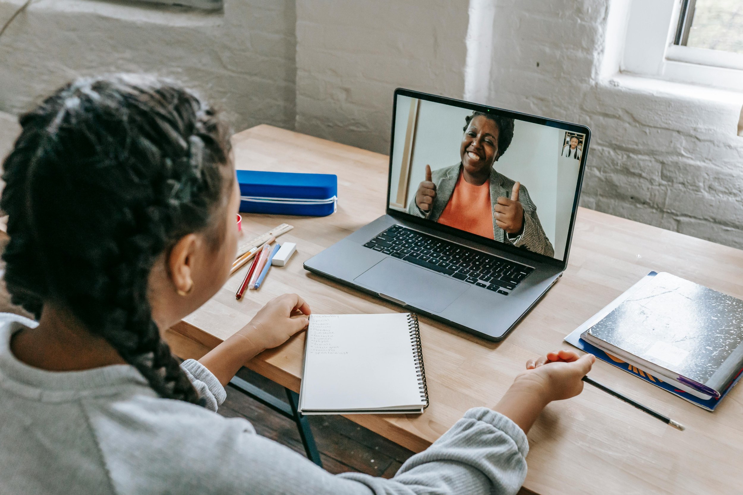 Client participating in online somatic therapy in British Columbia while practicing grounding during a virtual session at home.