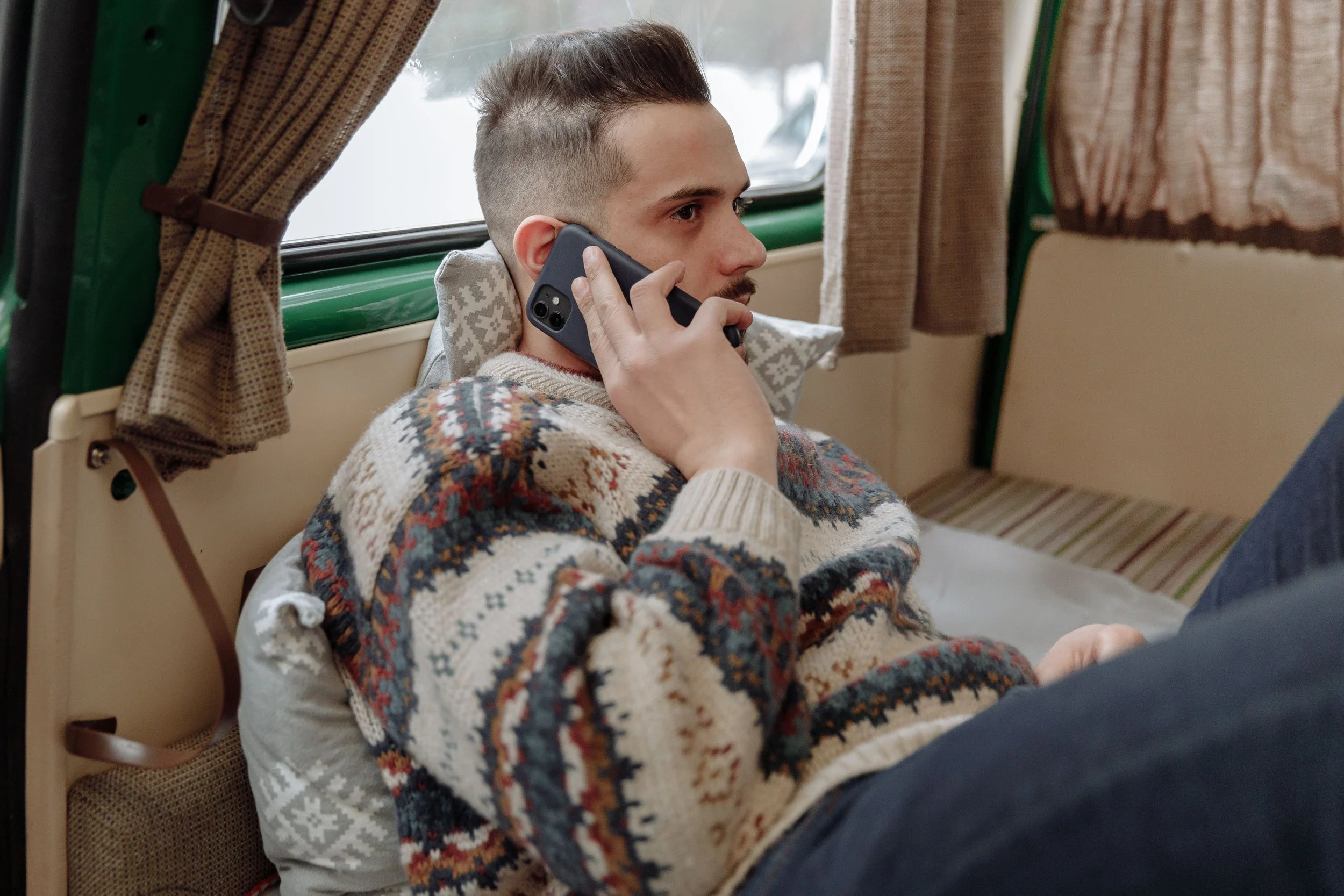 Person preparing to make a phone call with notes nearby