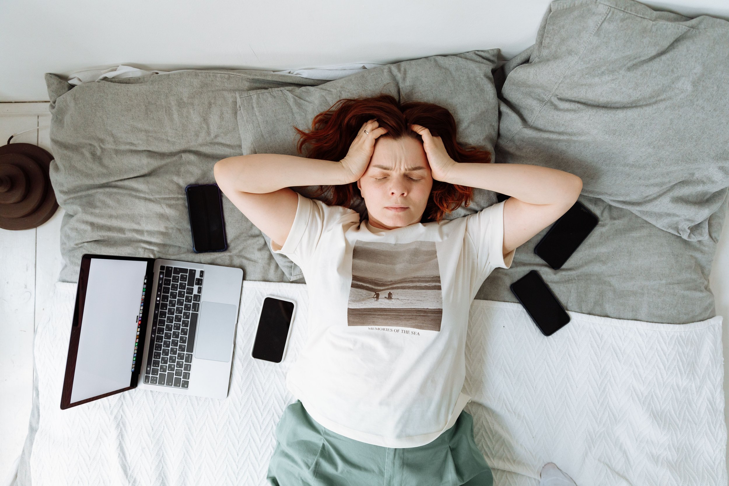Adult managing several group-chat notifications while trying to focus