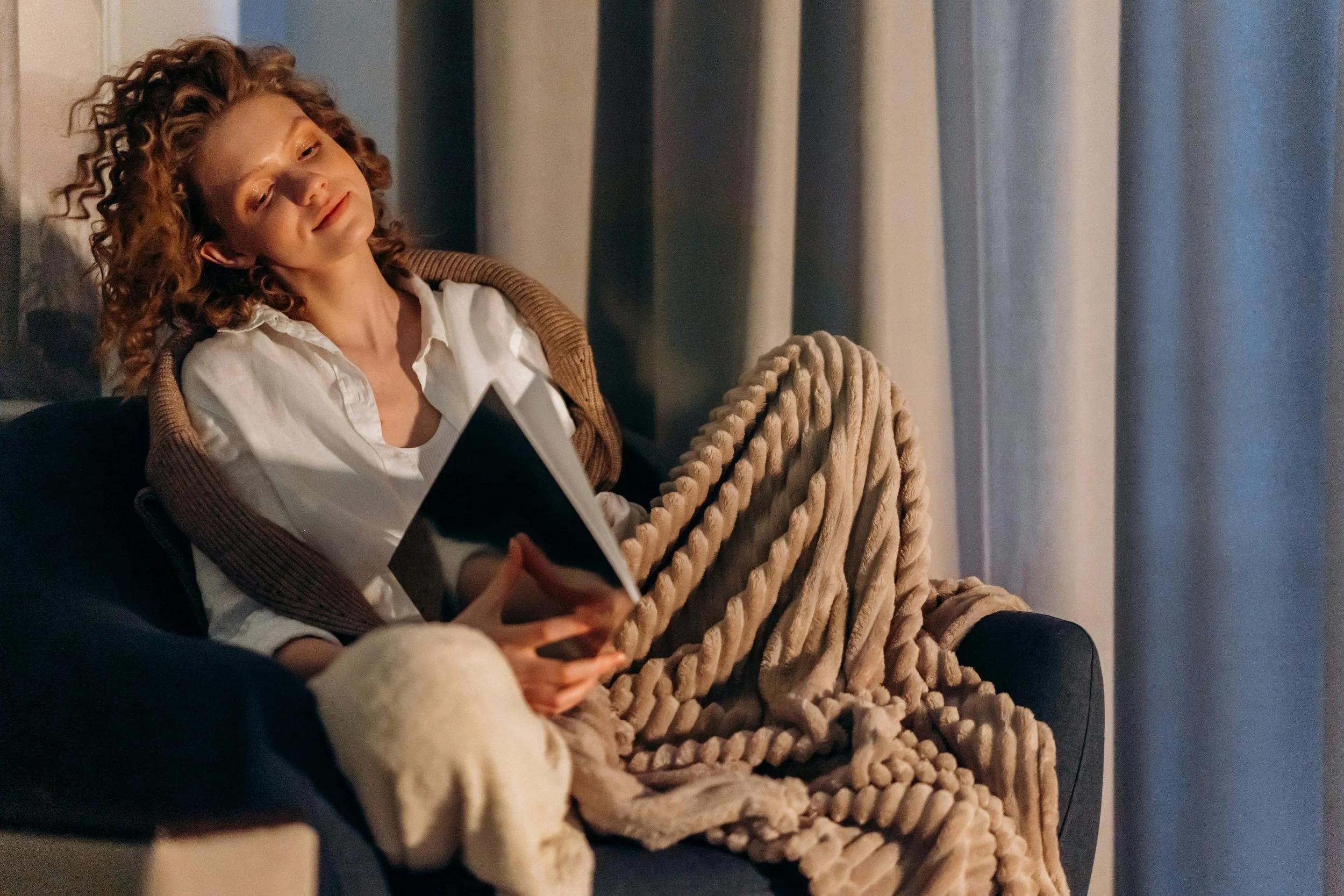 Woman in quiet reflection during online therapy session for long COVID in Canada