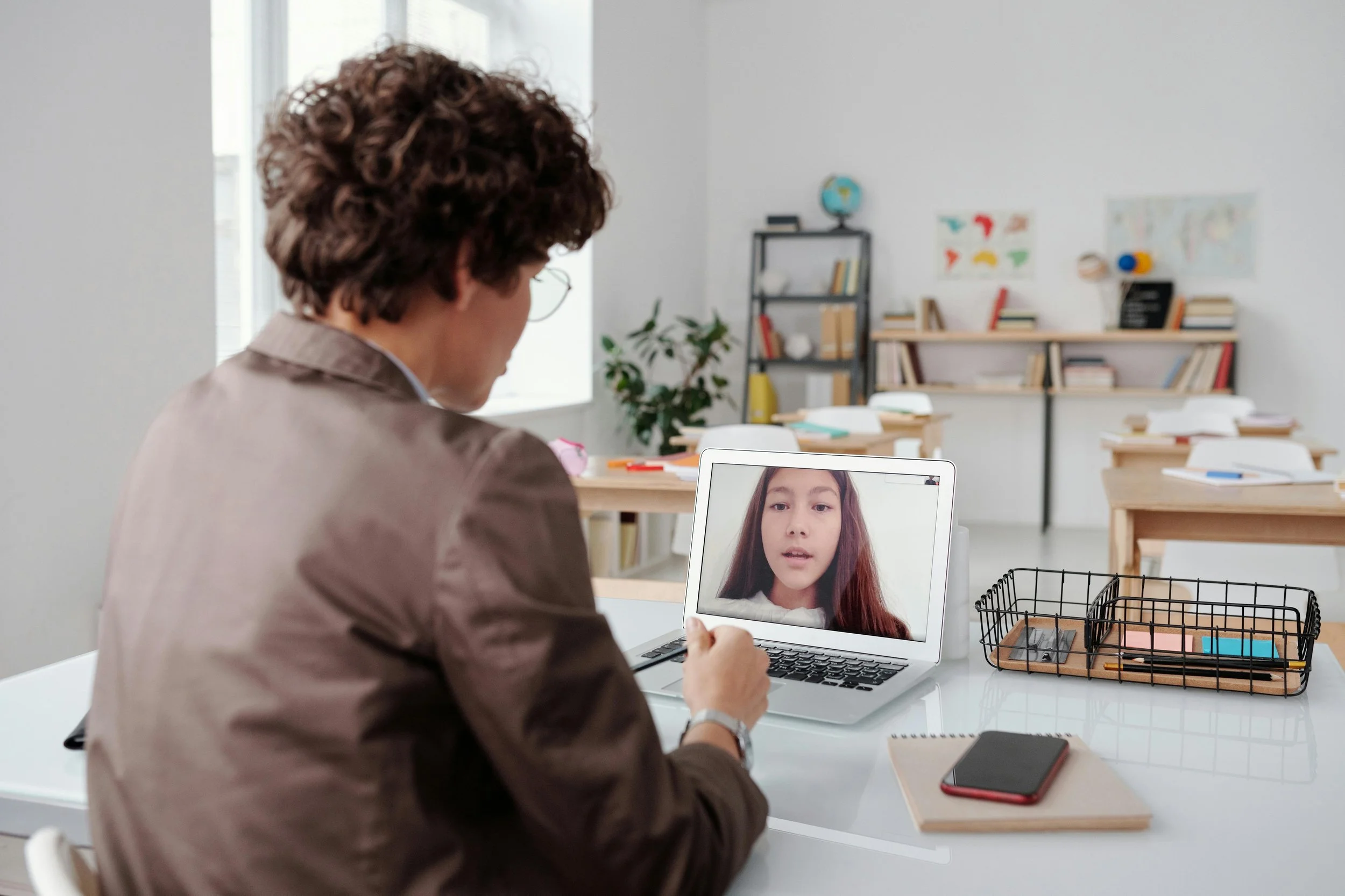 Client participating in online somatic therapy in British Columbia while practicing grounding during a virtual session at home.