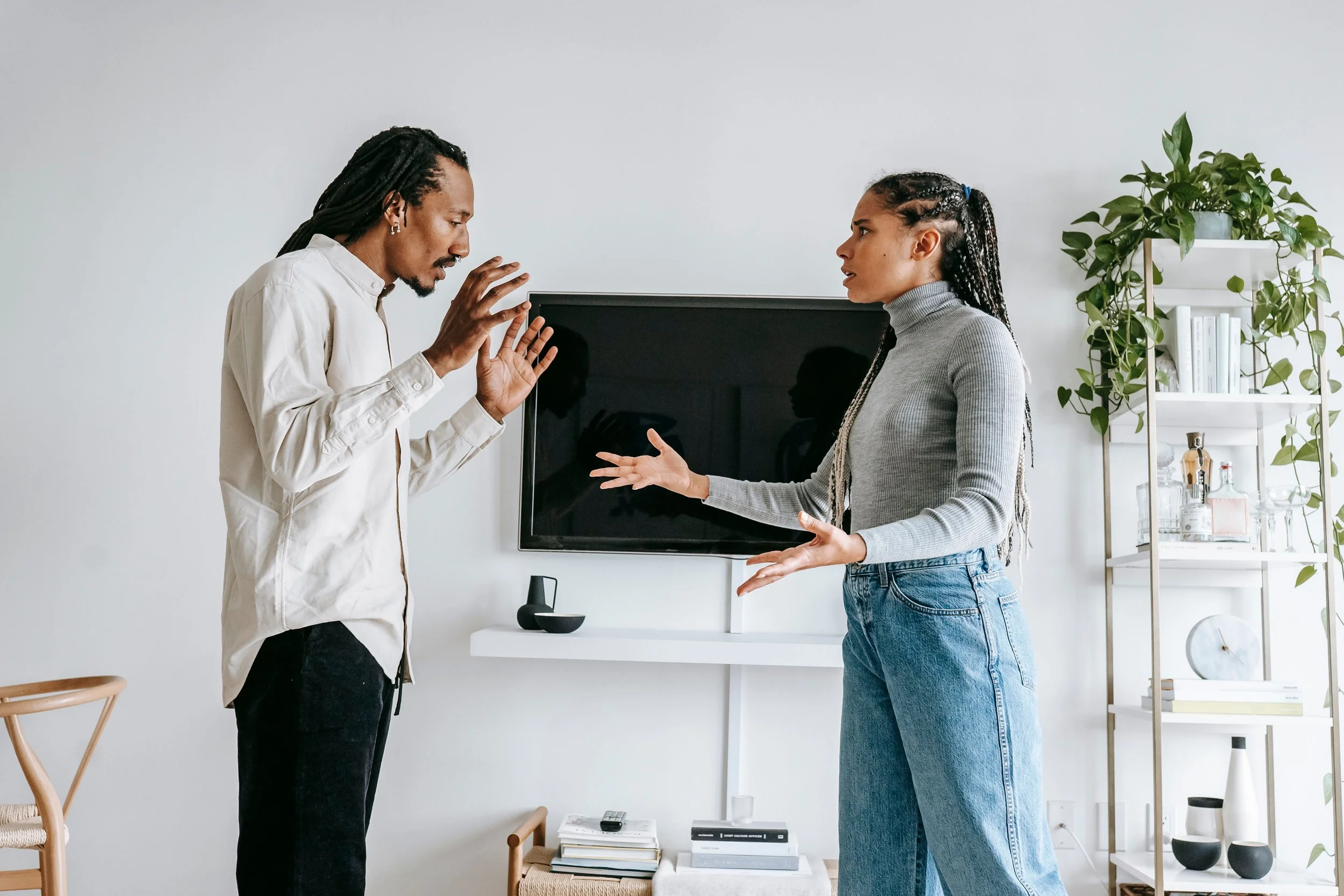 Person feeling overwhelmed and unable to find words during a difficult conversation