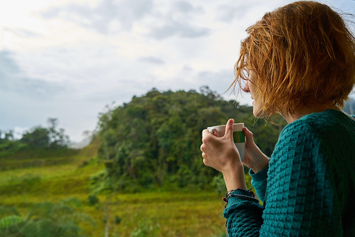 A woman drinking spearmint tea  which is one of the best teas for fertility