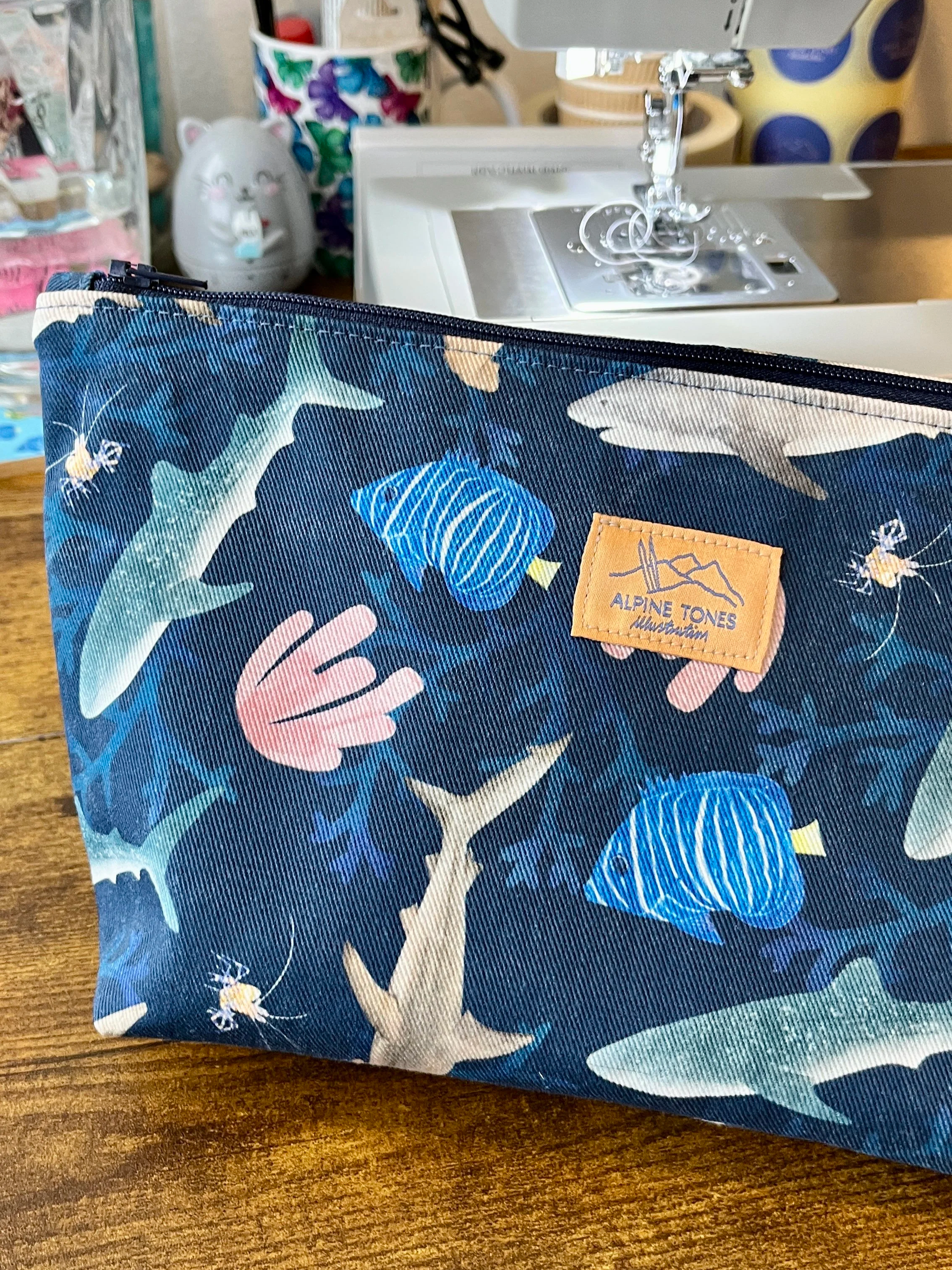 World+Oceans+Day+Large+Pouch+-+Alpine+Tones+Illustration.png