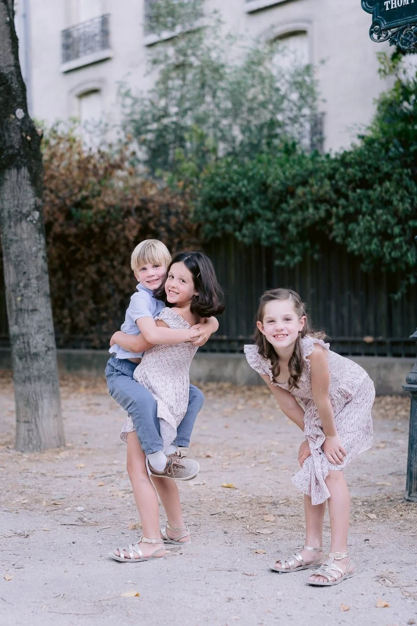 Relaxed family portrait in Paris with genuine expressions and natural connection