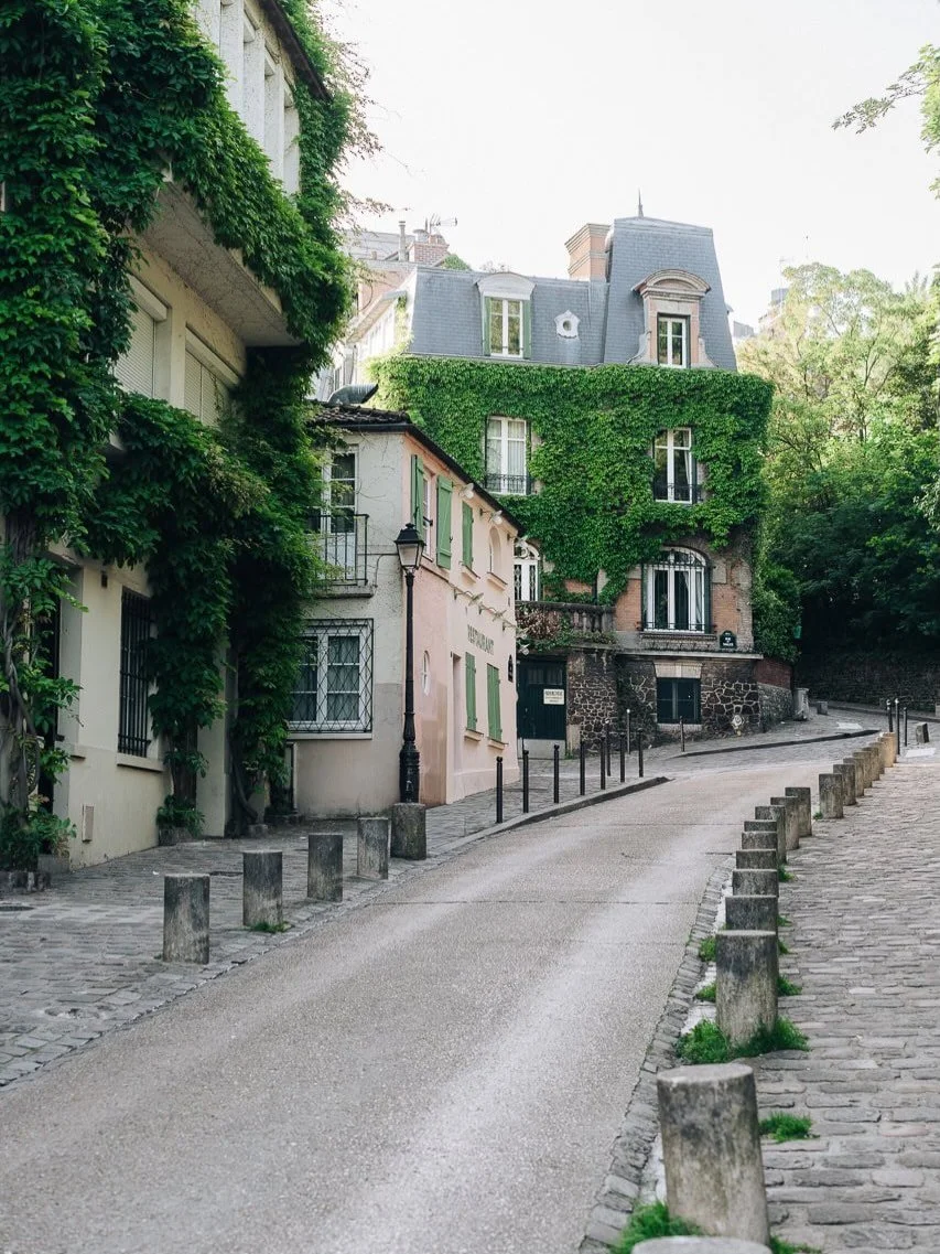 Montmartre feels like a little village hidden inside Paris. 

Cobblestone streets, ivy-covered corners, charming caf&eacute;s, and those quiet cinematic moments you can&rsquo;t fake &mdash; every turn feels like the perfect backdrop for your story.

