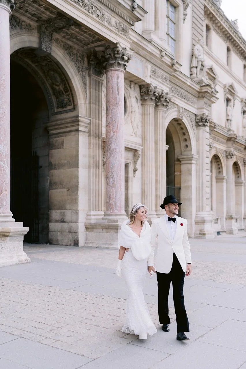 Stylish couple photographed at the Louvre for an engagement-style portrait session