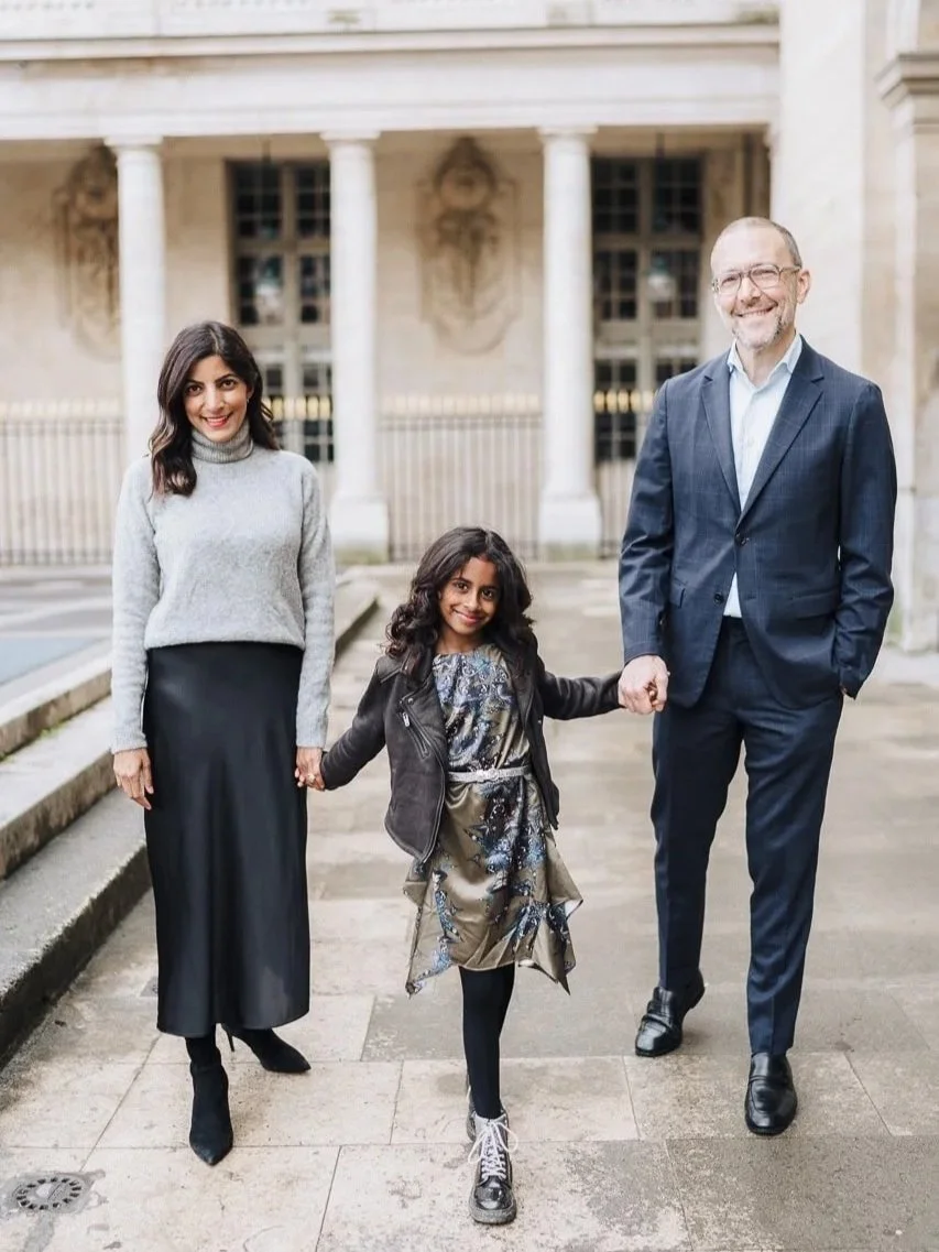 stylish family dressed in warm tones for their Paris photoshoot with Ian Holmes