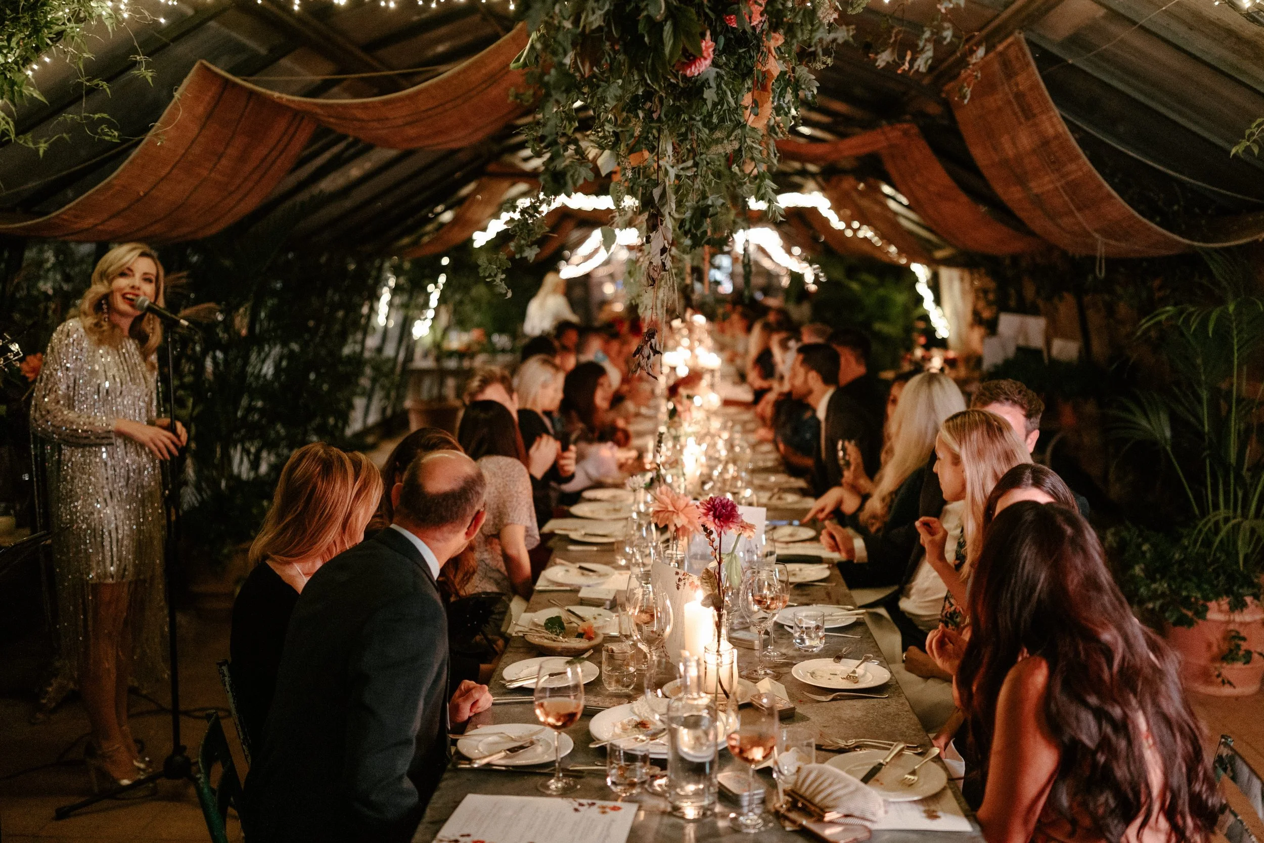 Kathryn B Wilson speaking at Autumn and Adam's intimate wedding dinner at Petersham Nurseries Richmond