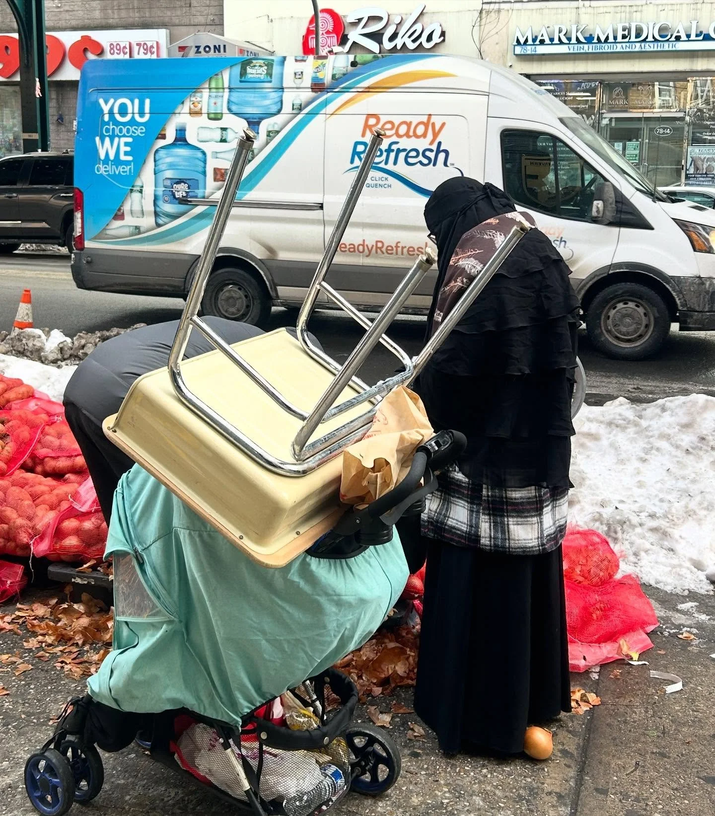 A mother, her child, free food, and a school desk carried through the cold with determination and love.

Our families are strong. Our families are defiant. And we are honored to support them.