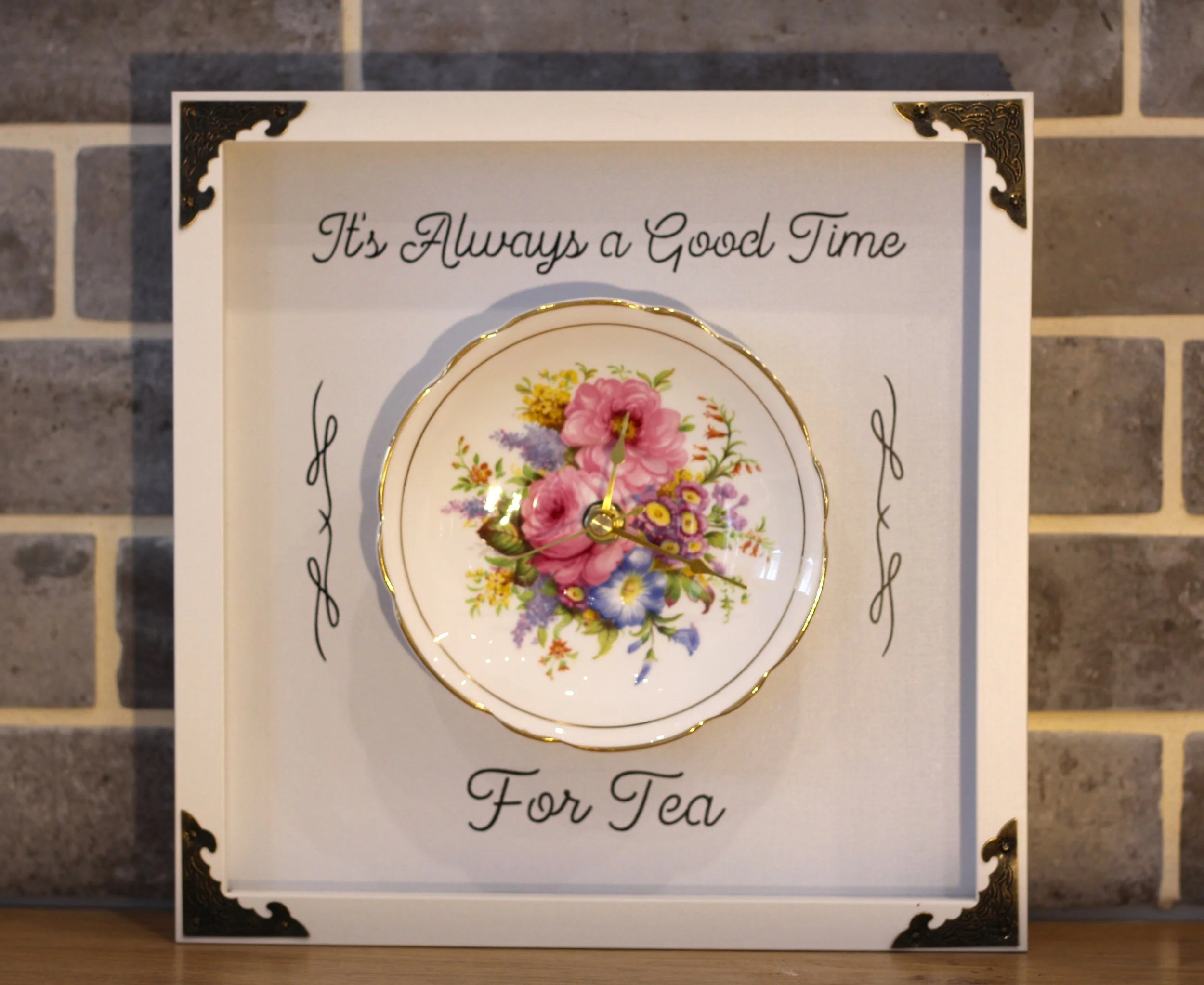 Tea time clock with mixed floral centre.JPG