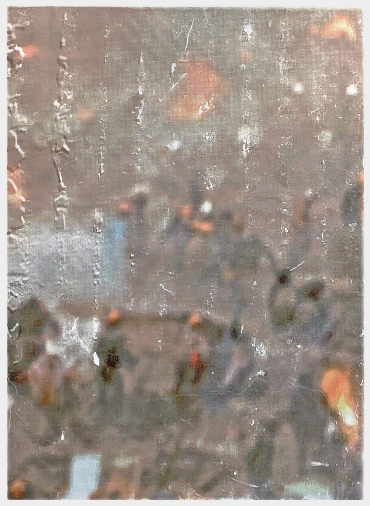 Blurred view through a rainy window showing several people walking outside on a city street at night.