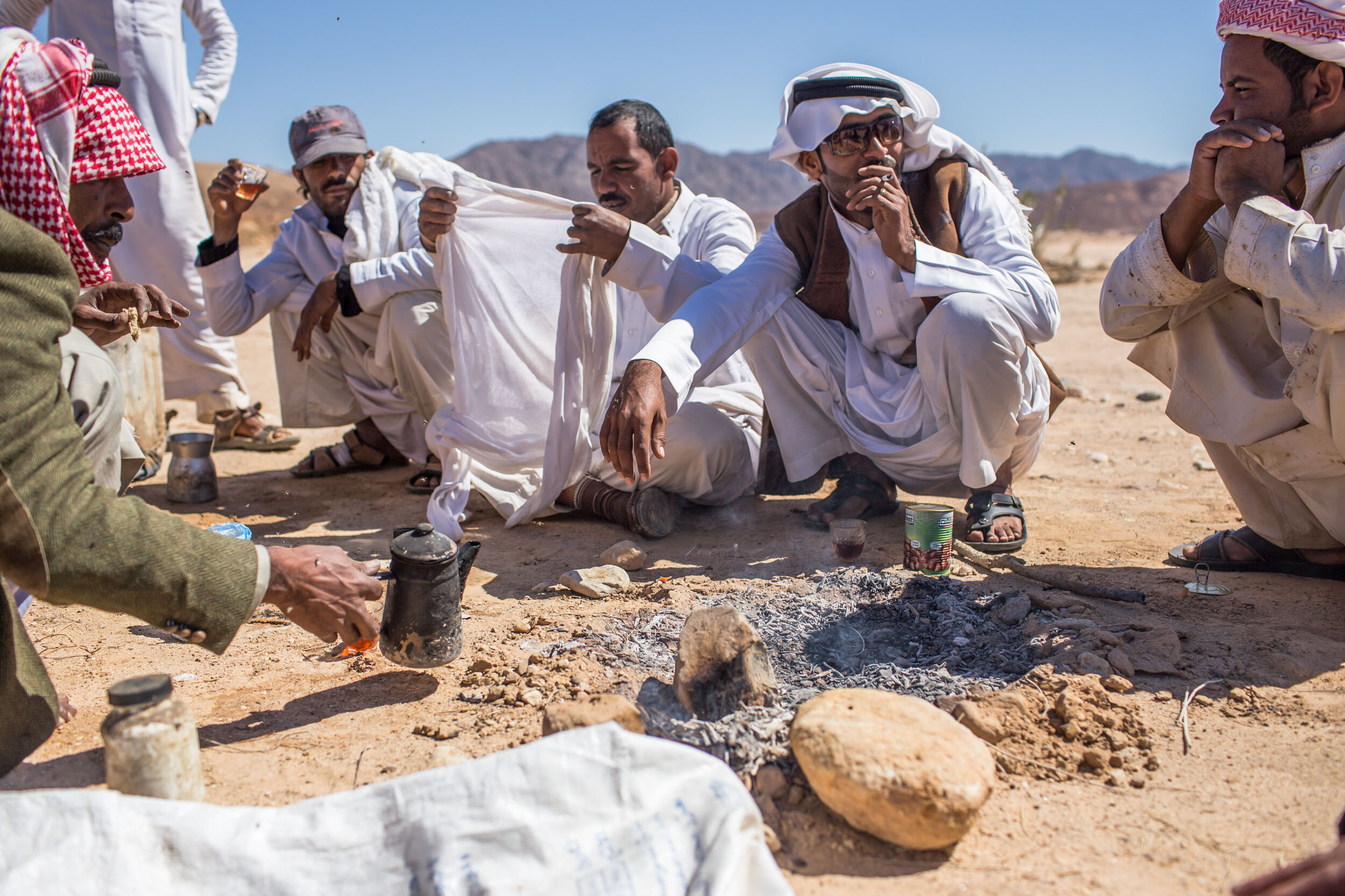 Beside a field of poppies, near Egypt’s popular Red Sea resorts, sit a motley crew of unlikely drug lords: a oud player, a resort chef and a taxi driver. They gather around a fire pit preparing tea for a mid-day break from harvesting opium.