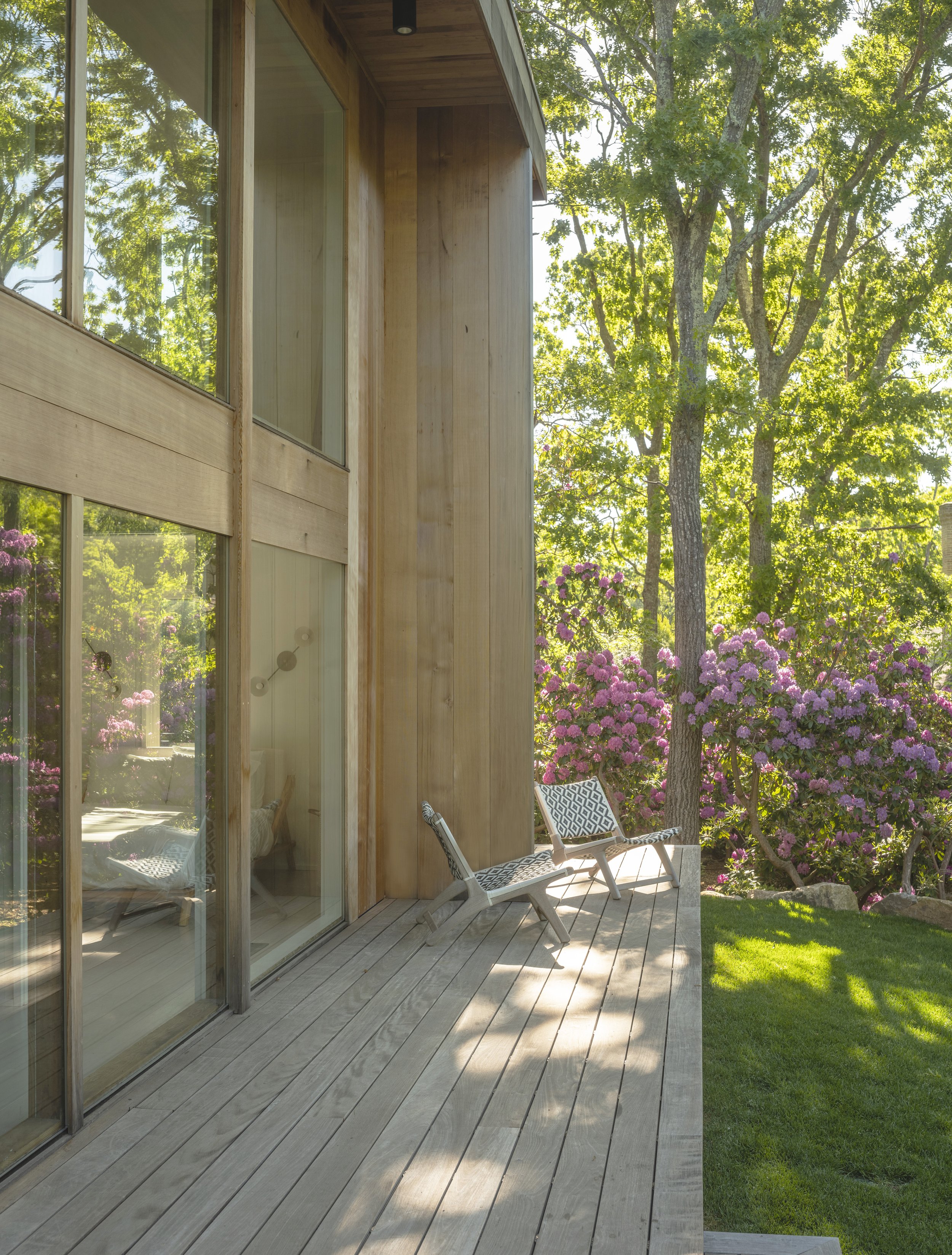 Robert Dean Architects restored and expanded this East Hampton home originally designed by Harry Bates. The original wrap around decks were rebuilt and new cedar siding was installed to match the original.