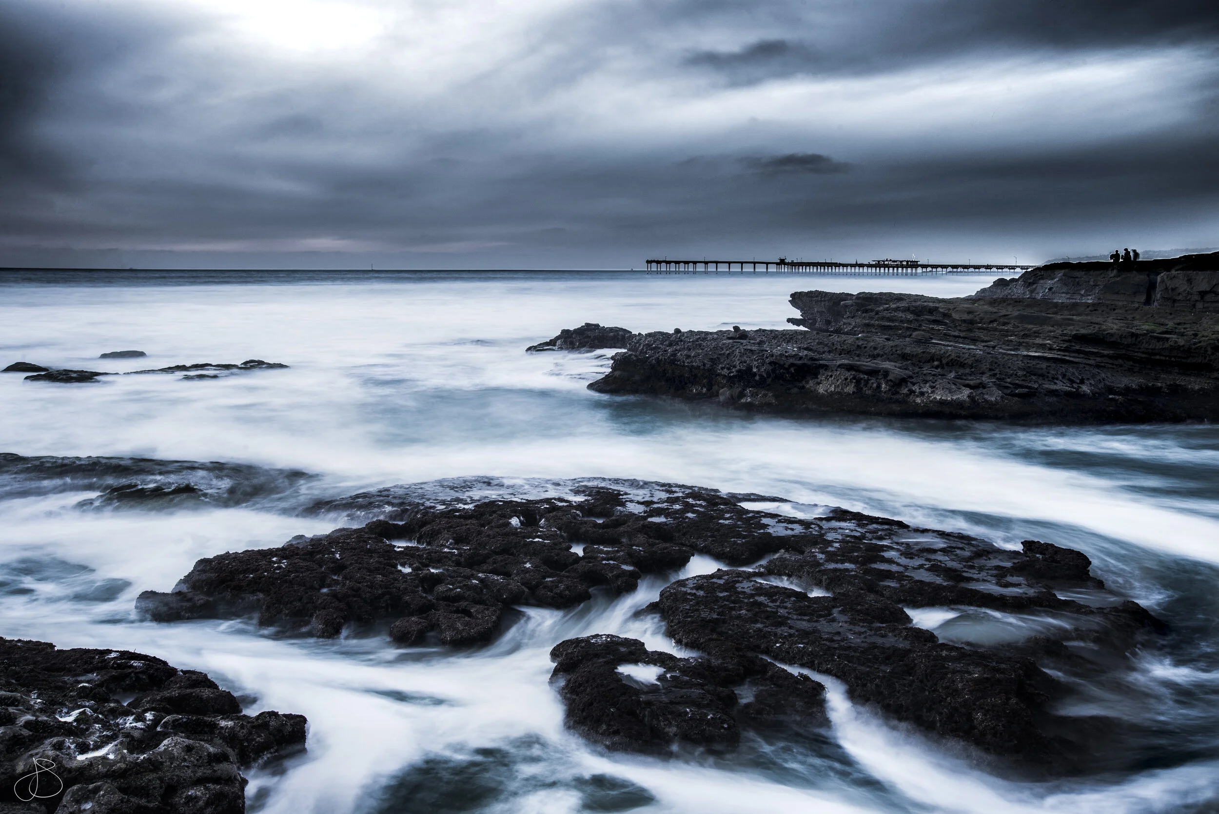 DSC_5069 blue contrast cloudy day rocks pier.jpg