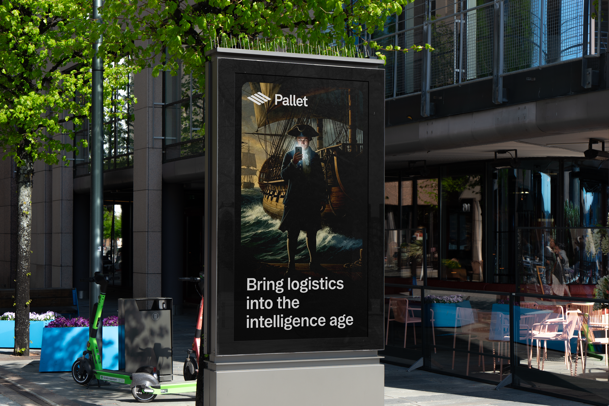 Billboard displaying an image of a 16th century sailor in front of a sailing ship, with the text "Bring logistics into the intelligence age", and the logo "Pallet" at the top.