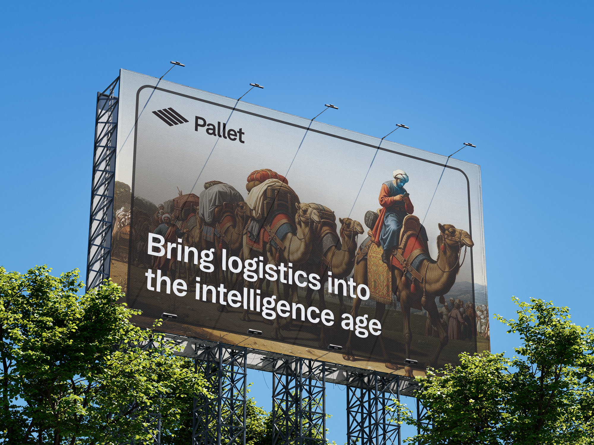 Billboard with a painting of people riding camels, and a person in traditional attire using a mobile phone, with a blue sky background and green trees in the foreground. The billboard has the logo 'Pallet' and the slogan 'Bring logistics into the intelligence age.'