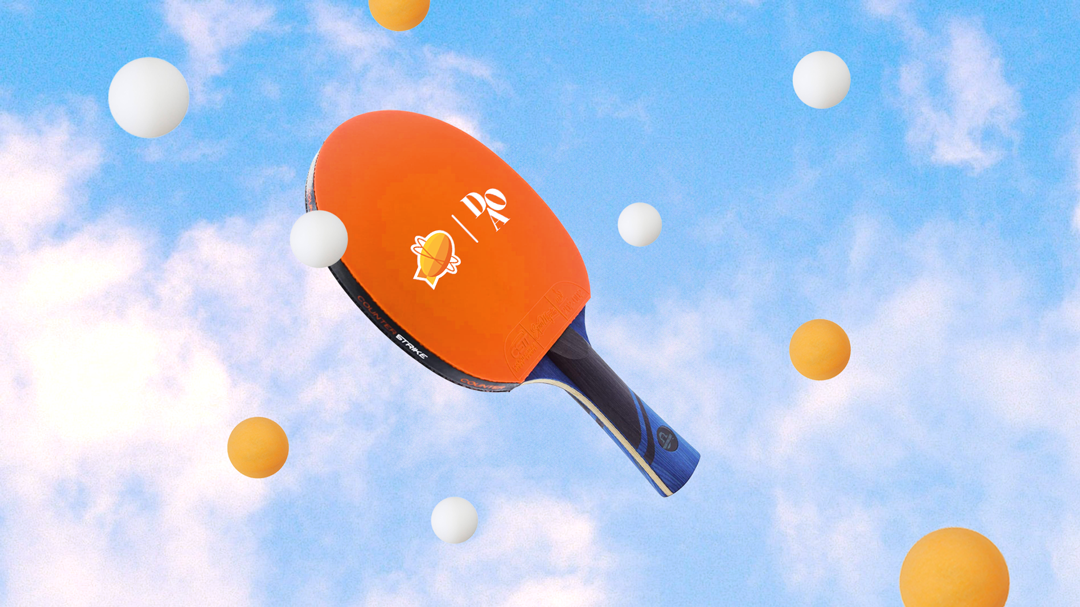 An orange ping-pong paddle floating in a blue sky with white clouds, surrounded by white and yellow ping-pong balls.
