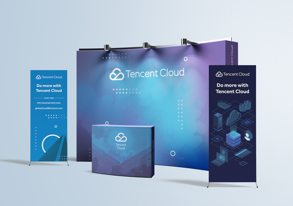 Promotional banners and a booth for Tencent Cloud with blue and purple color themes and cloud graphics.