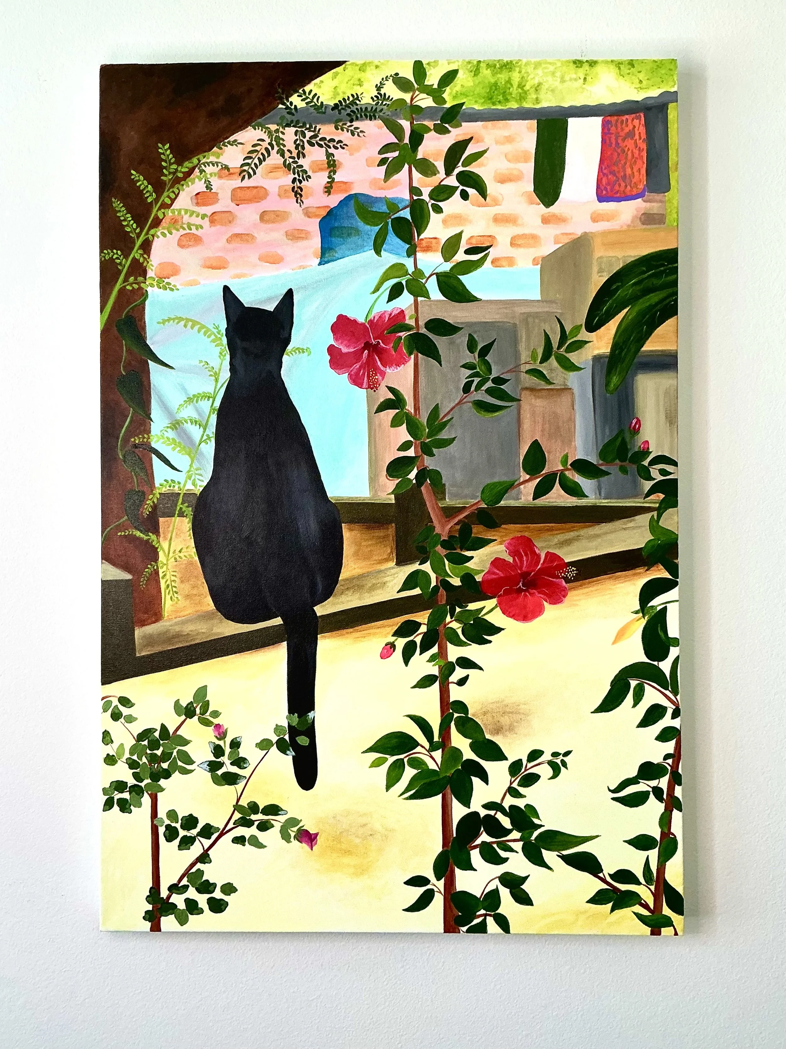 A painting of a black cat sitting on a windowsill, surrounded by green plants and pink flowers, with a view of a brick building and clothes hanging outside.