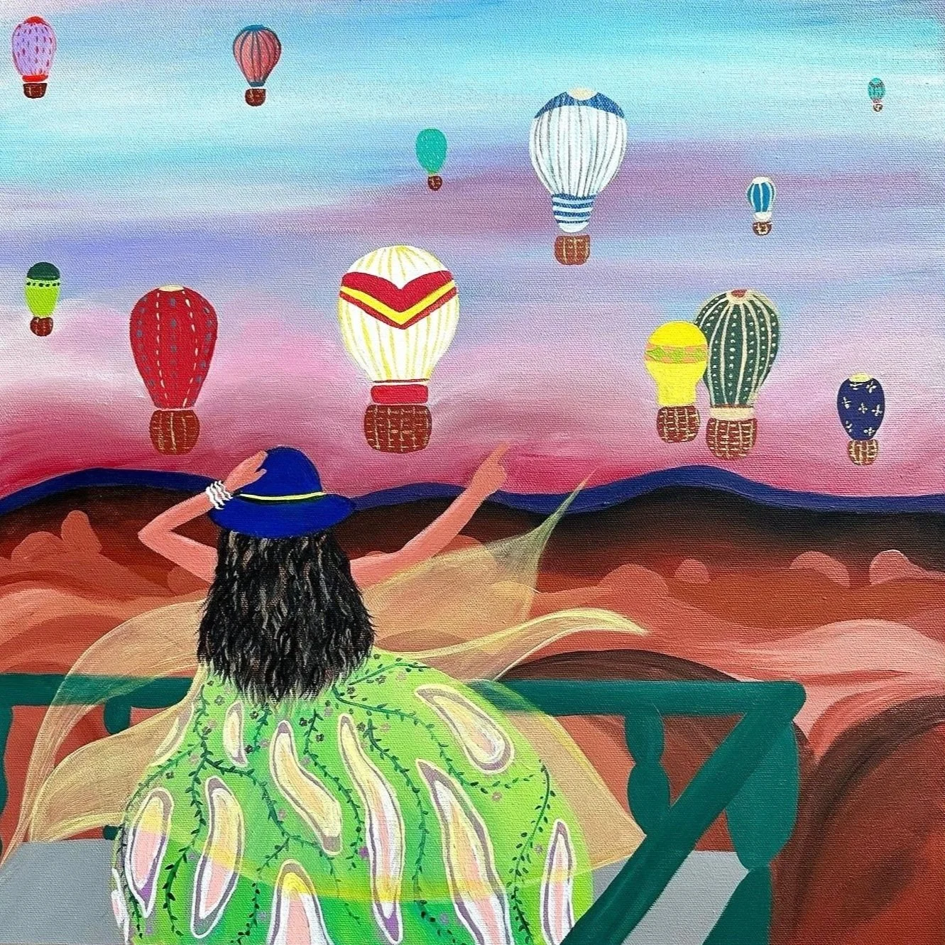 A woman sitting on a balcony wearing a green dress, a blue hat, and jewelry, looking at floating colorful hot air balloons in a sky with pink and blue hues.