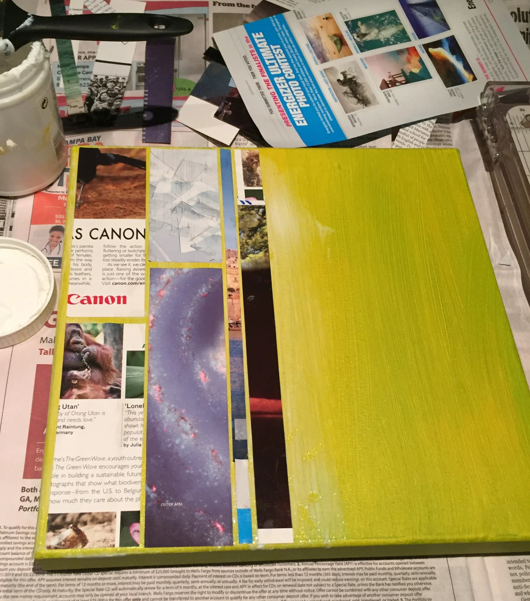 The cut magazines are adhered to the page with varying widths and spaces. I like the integration of text and images. The words give it another layer and add interest to the work.
