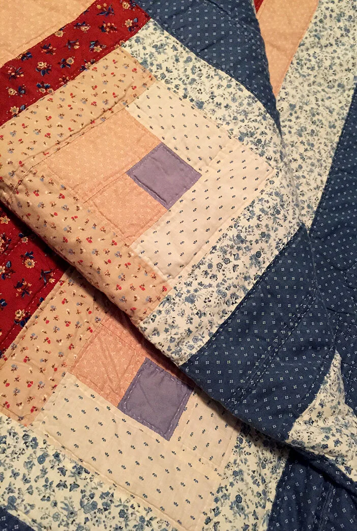 Beautiful Log Cabin pattern quilt made by my Mother, Dixie Doyel Youmans.