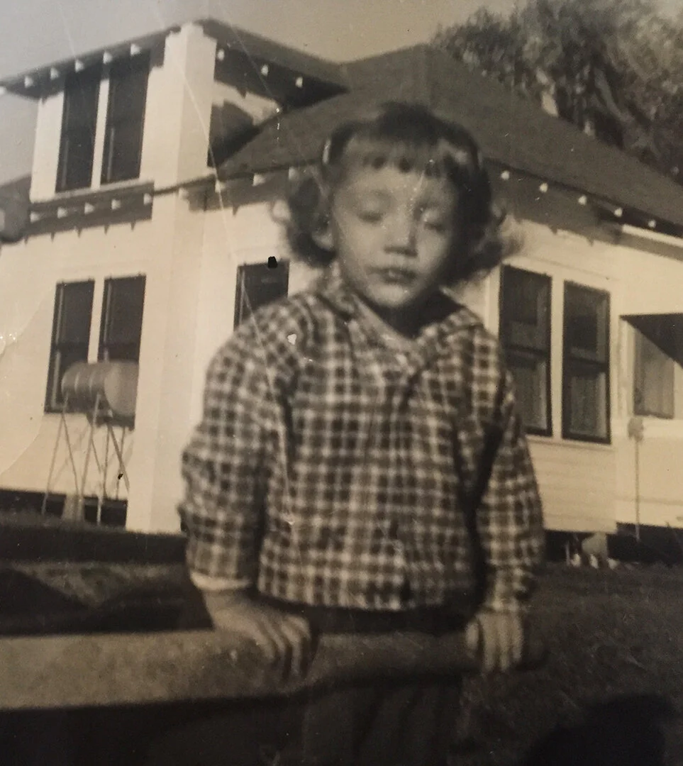 The old wooden house I grew up in. Built around 1920. And yes we had no air conditioning at home or at school.
