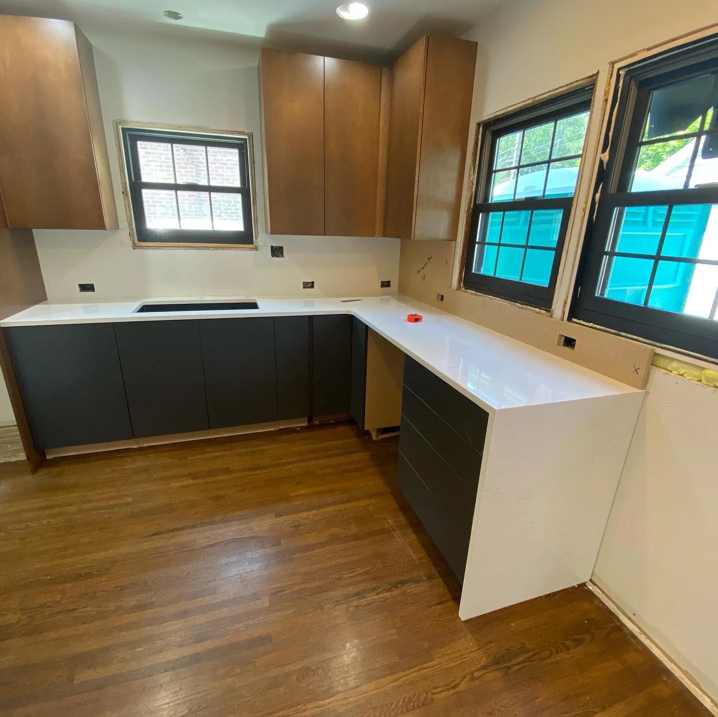 Check out these waterfall details on the ends of this base and peninsula, couldn’t be happier with how these countertops look... the backsplash is being templated right now and will be made of the same material 💁🏼‍♀️